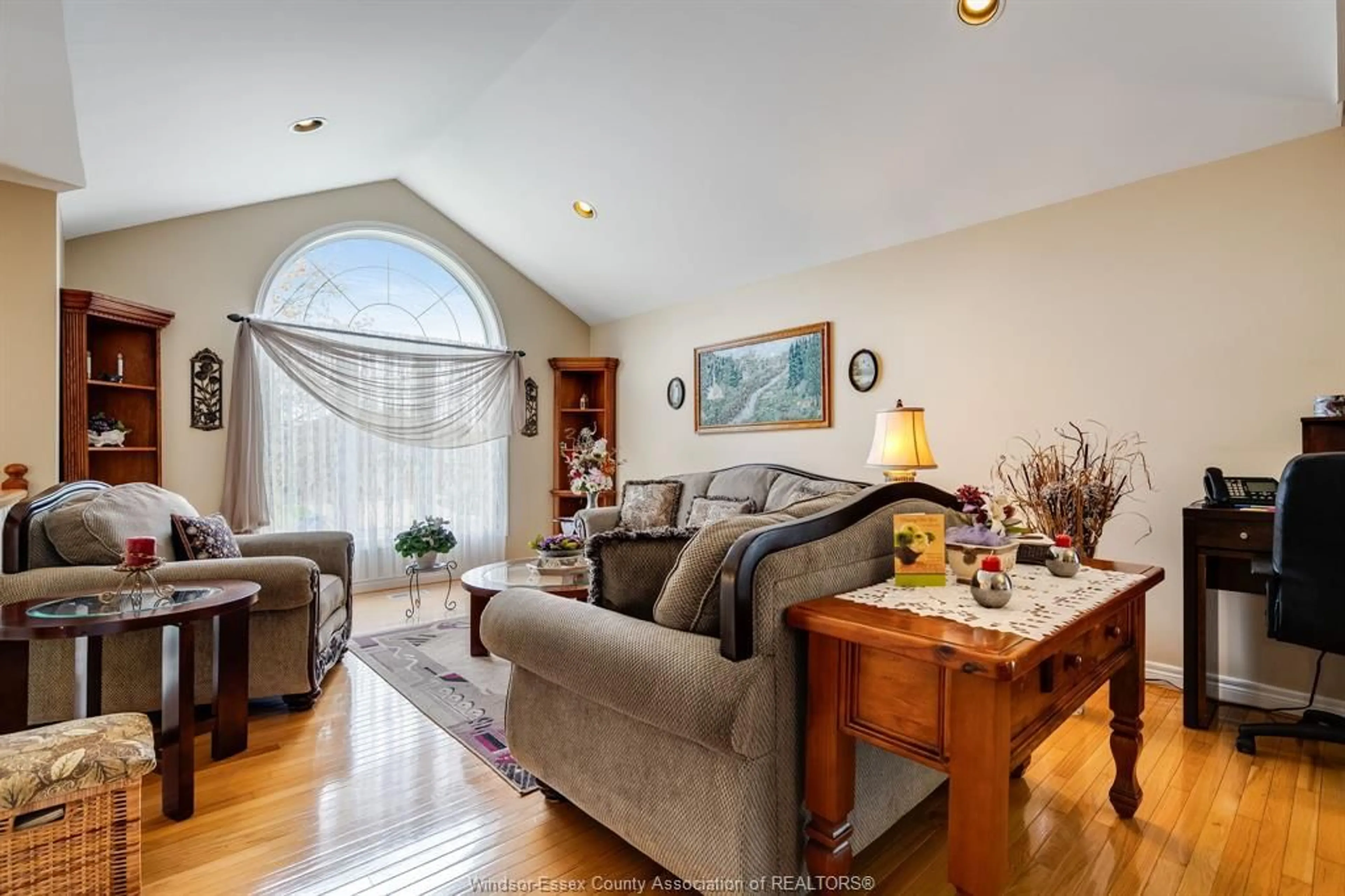 Living room with furniture, wood/laminate floor for 25 Regatta Dr, Leamington Ontario N8H 5L6