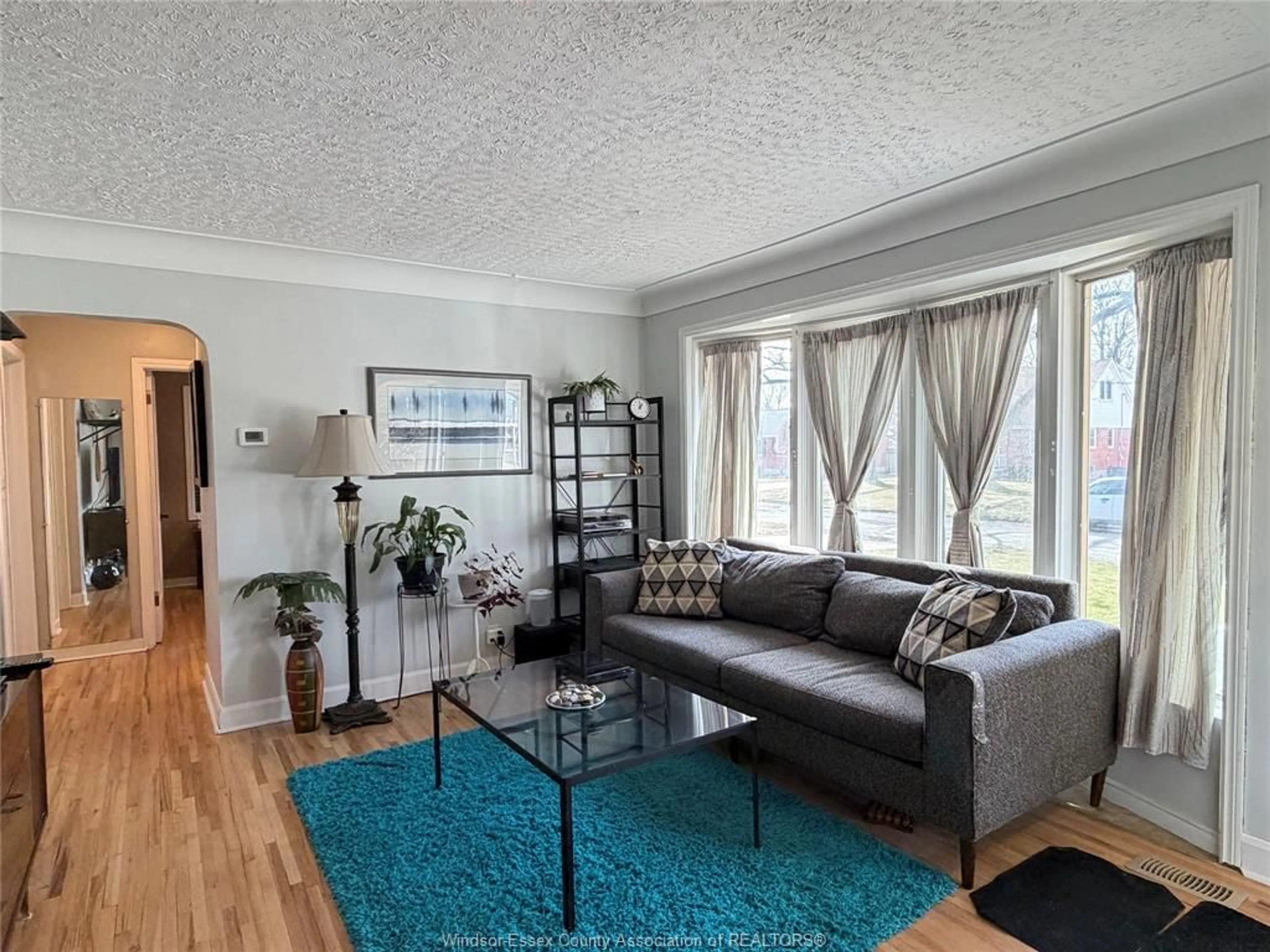 Living room with furniture, wood/laminate floor for 858 LAPORTE, Windsor Ontario N8S 3R4