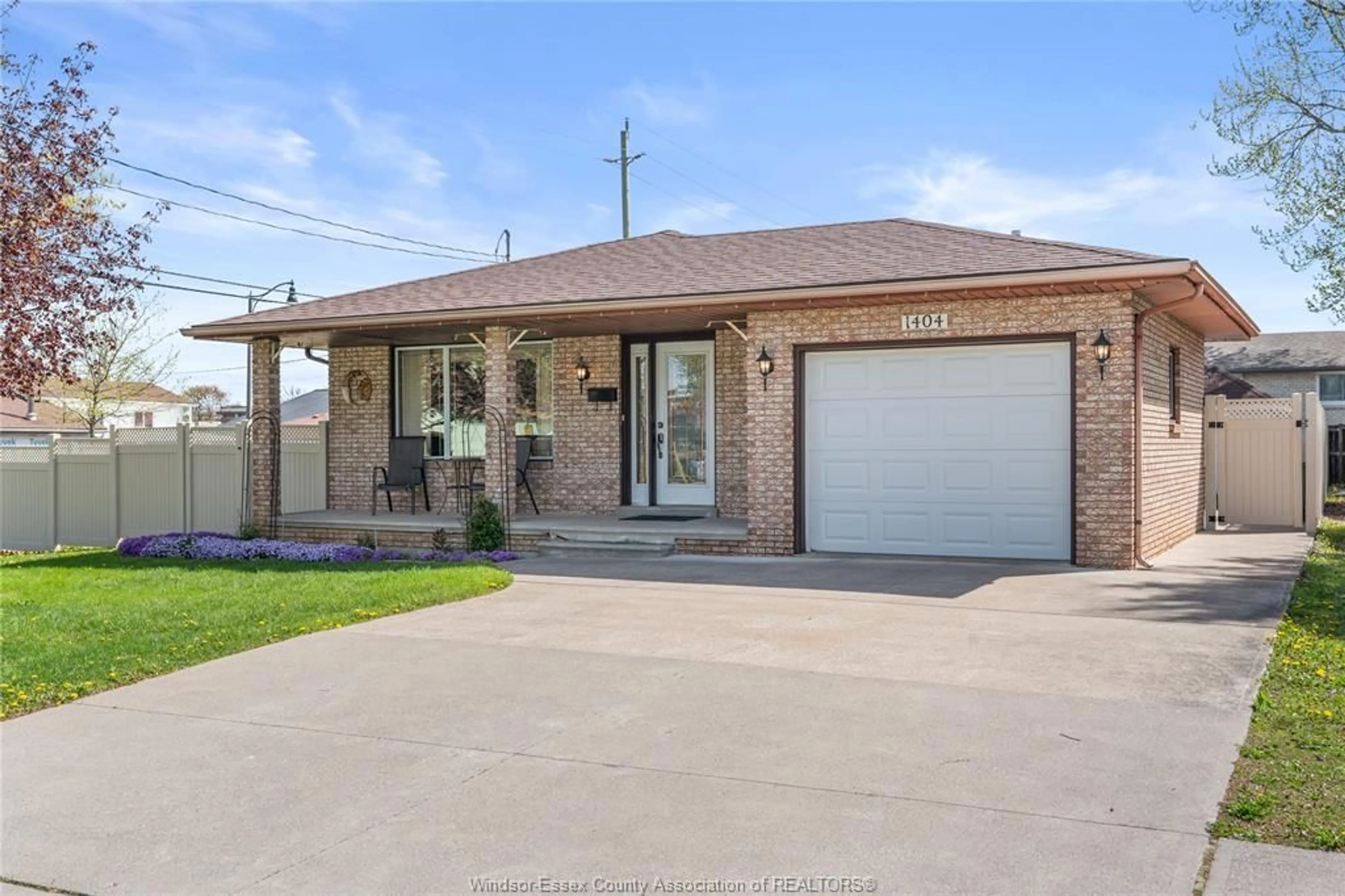 Home with brick exterior material, street for 1404 SHAWNEE Rd, Tecumseh Ontario N8N 1S2