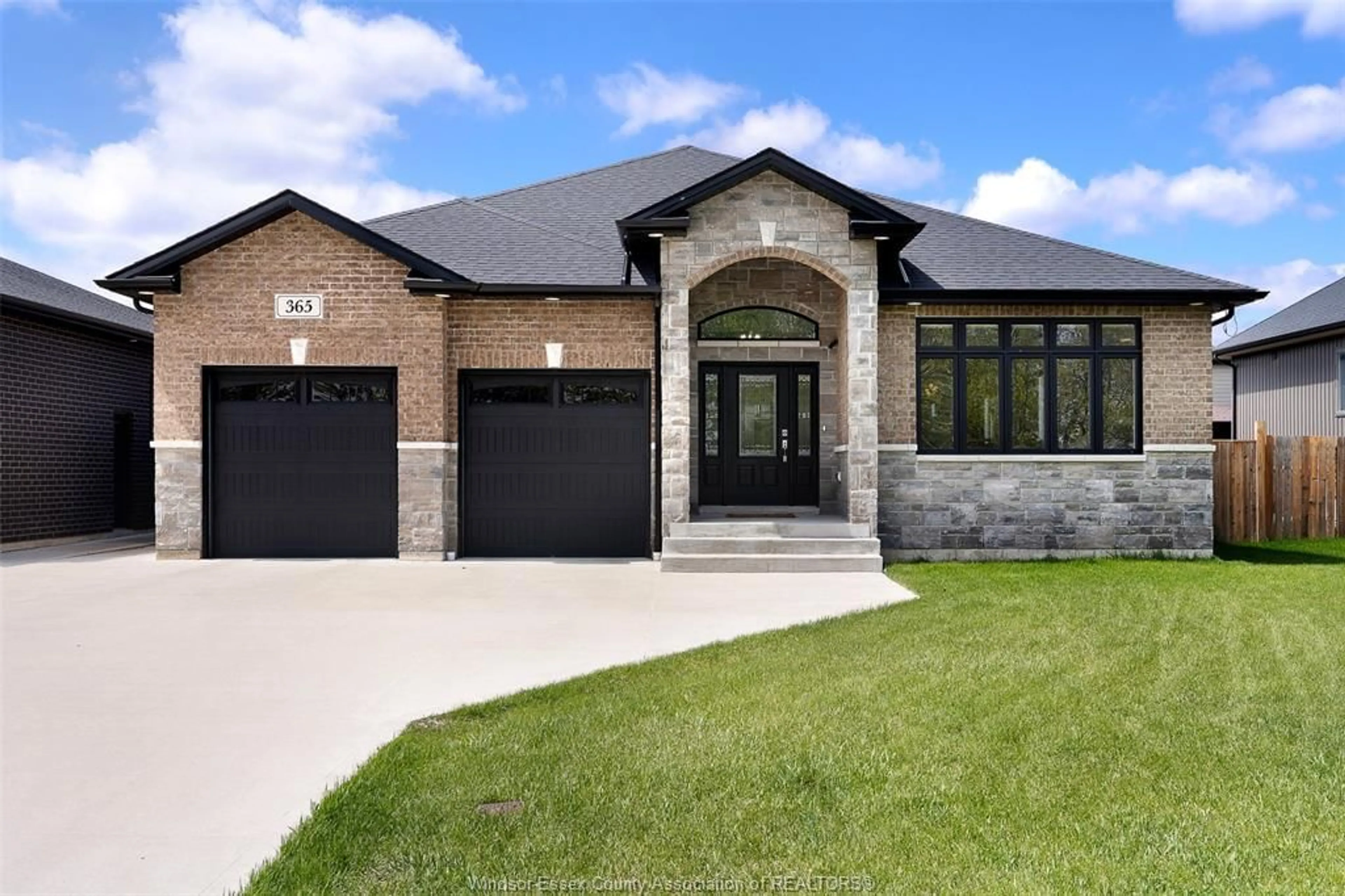 Home with brick exterior material, street for 365 COUNTY RD 2, Belle River Ontario N8L 0G8