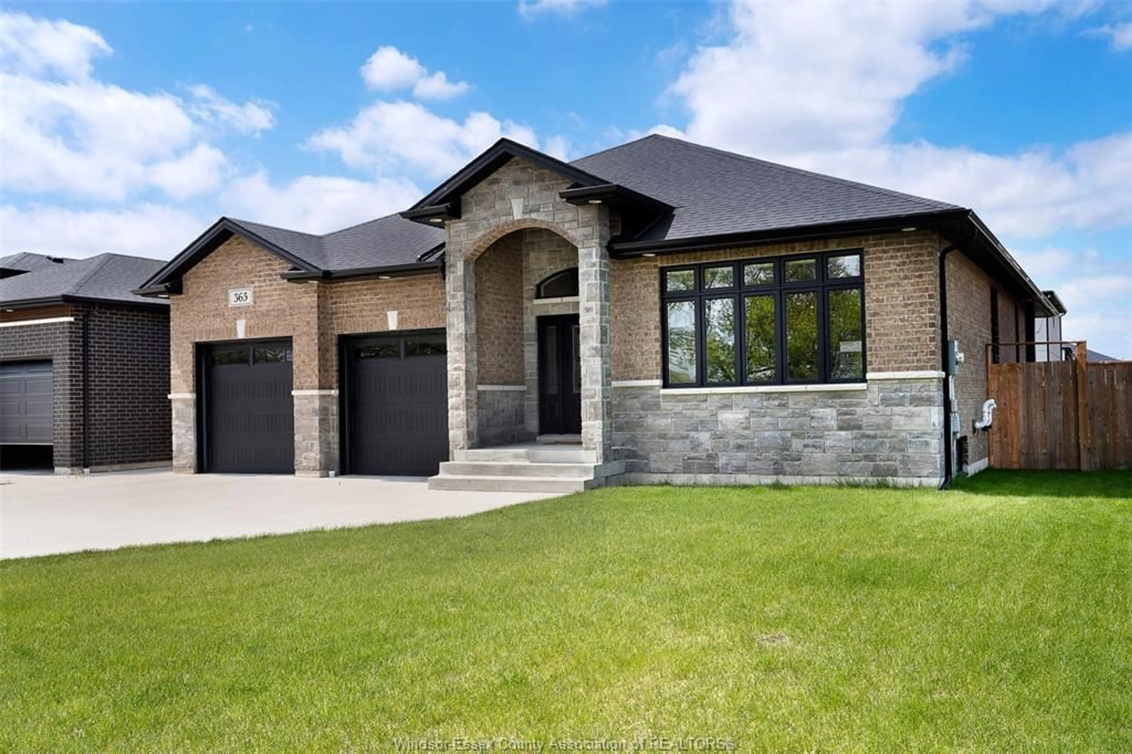 Home with brick exterior material, street for 365 COUNTY RD 2, Belle River Ontario N8L 0G8