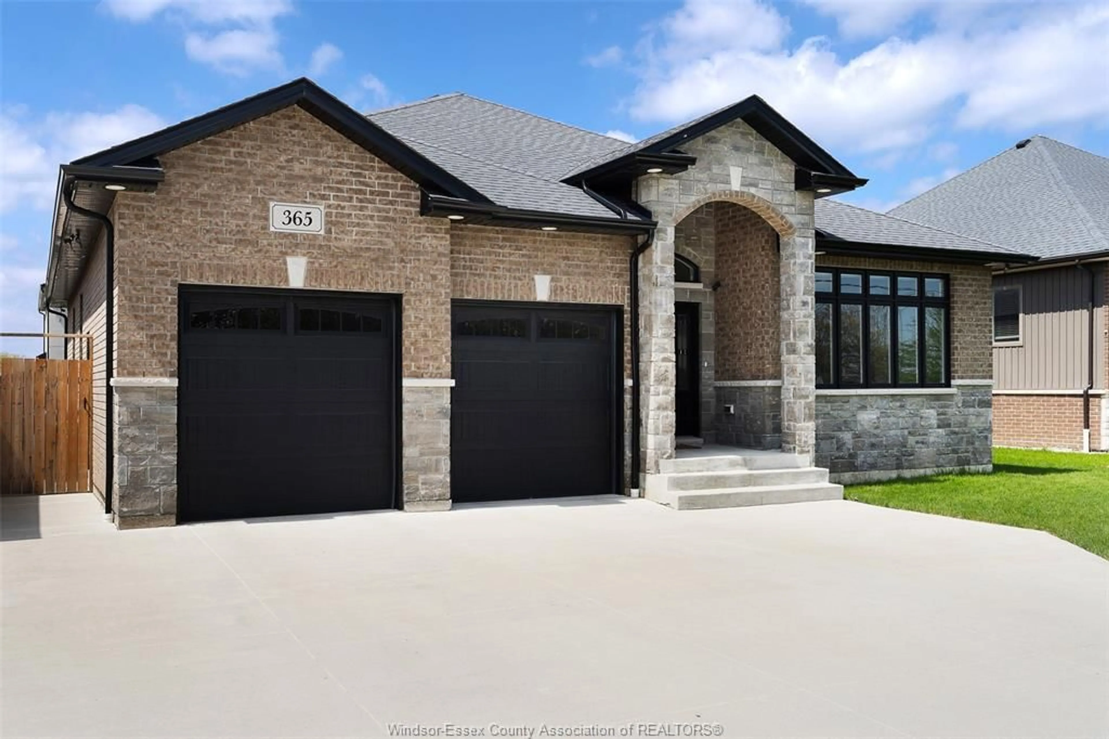 Home with brick exterior material, street for 365 COUNTY RD 2, Belle River Ontario N8L 0G8