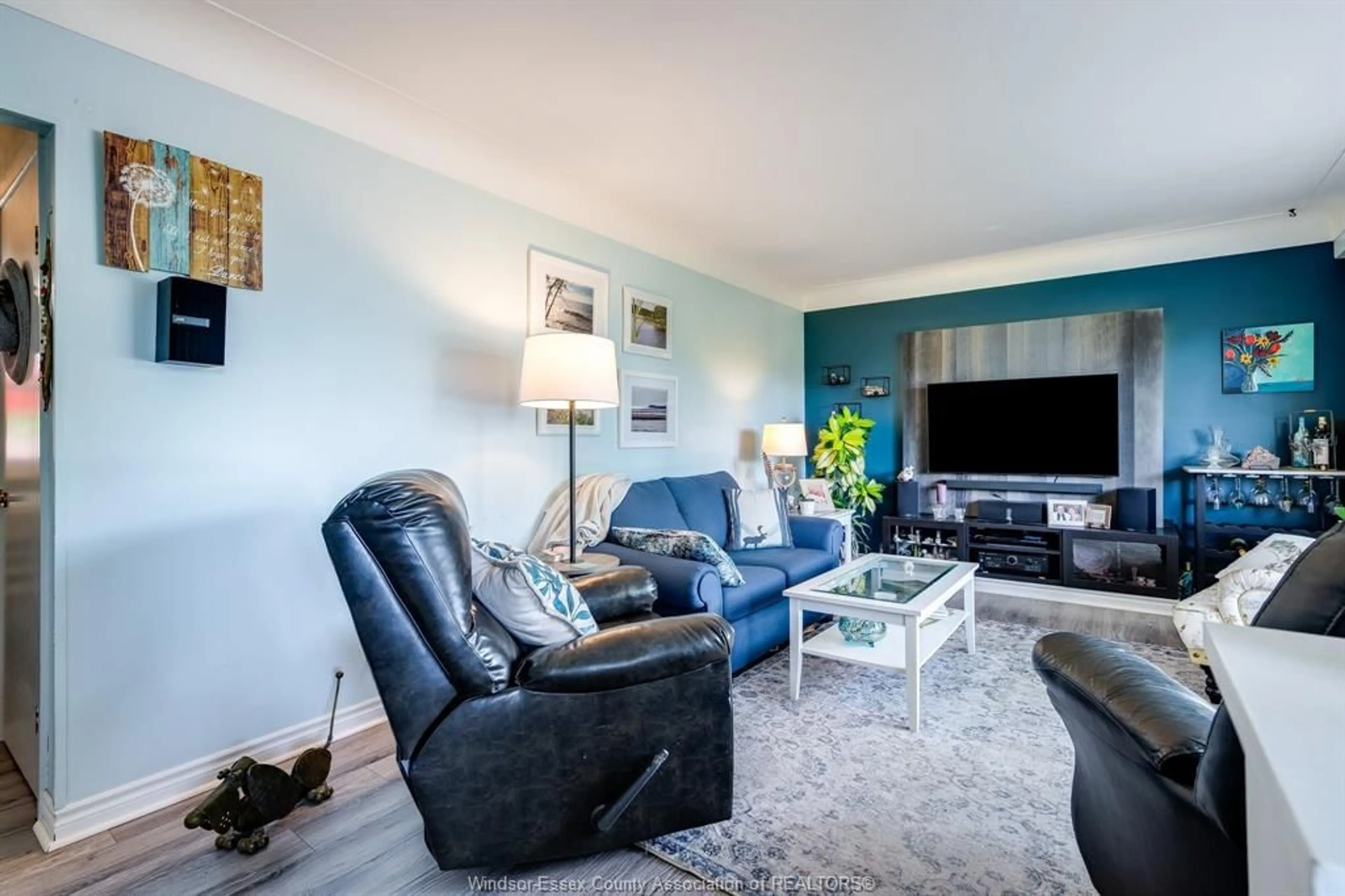 Living room with furniture, unknown for 27 Mersea Rd. 12, Leamington Ontario N8H 3V4