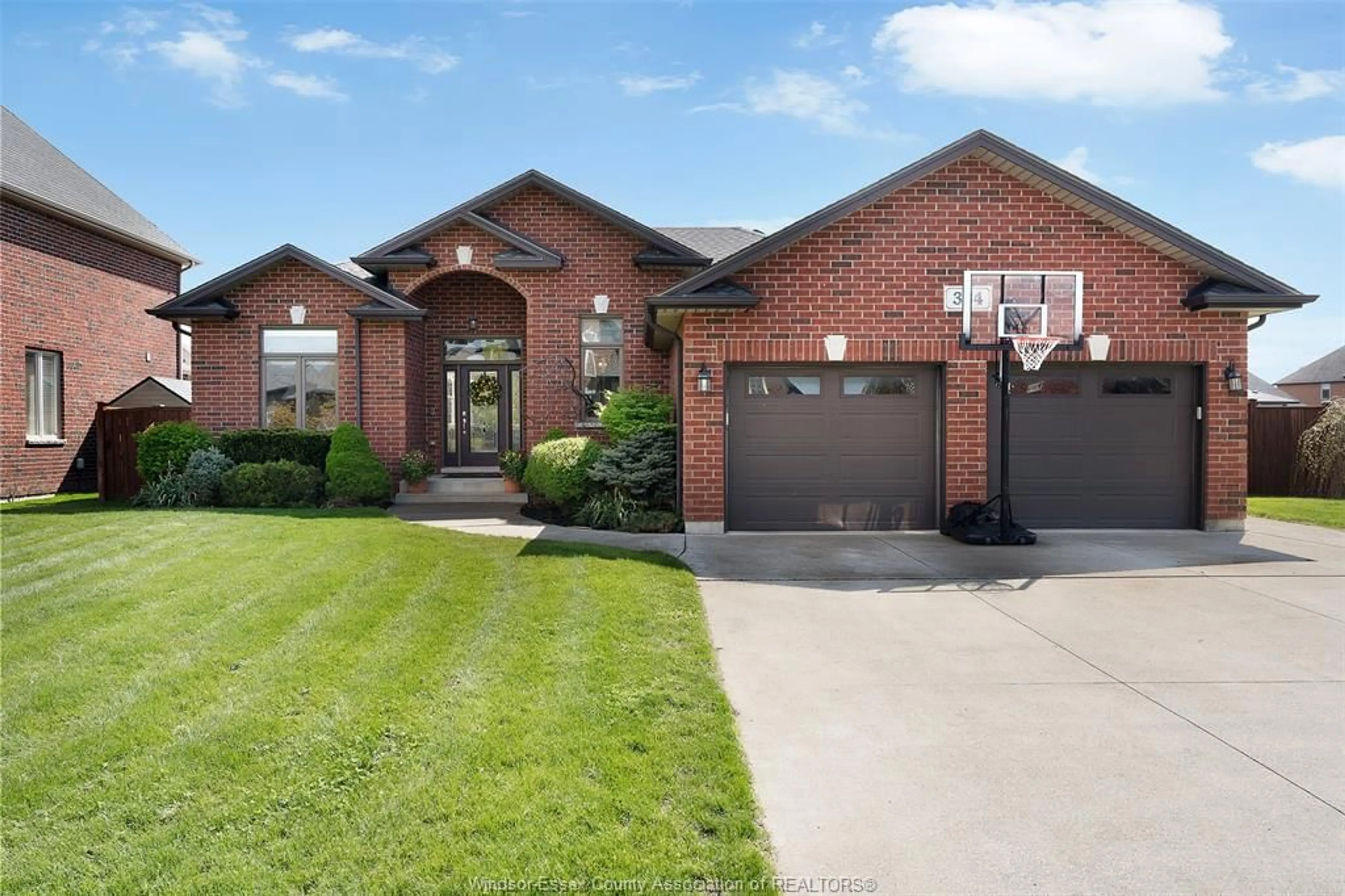 Home with brick exterior material, street for 384 EVERGREEN Dr, Lakeshore Ontario N8L 0X4
