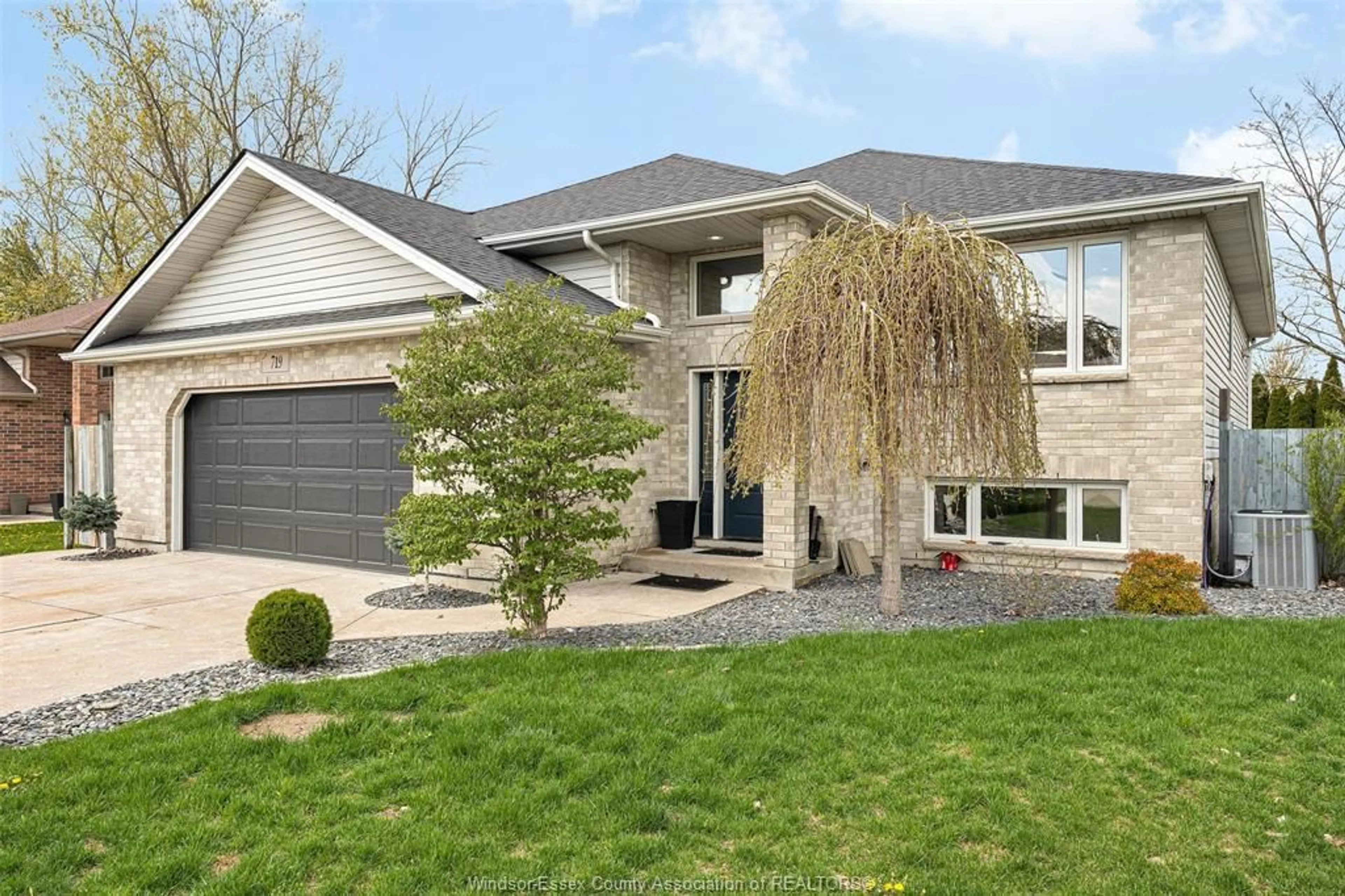 Home with brick exterior material, street for 719 HELENA Cres, Belle River Ontario N8L 0P7