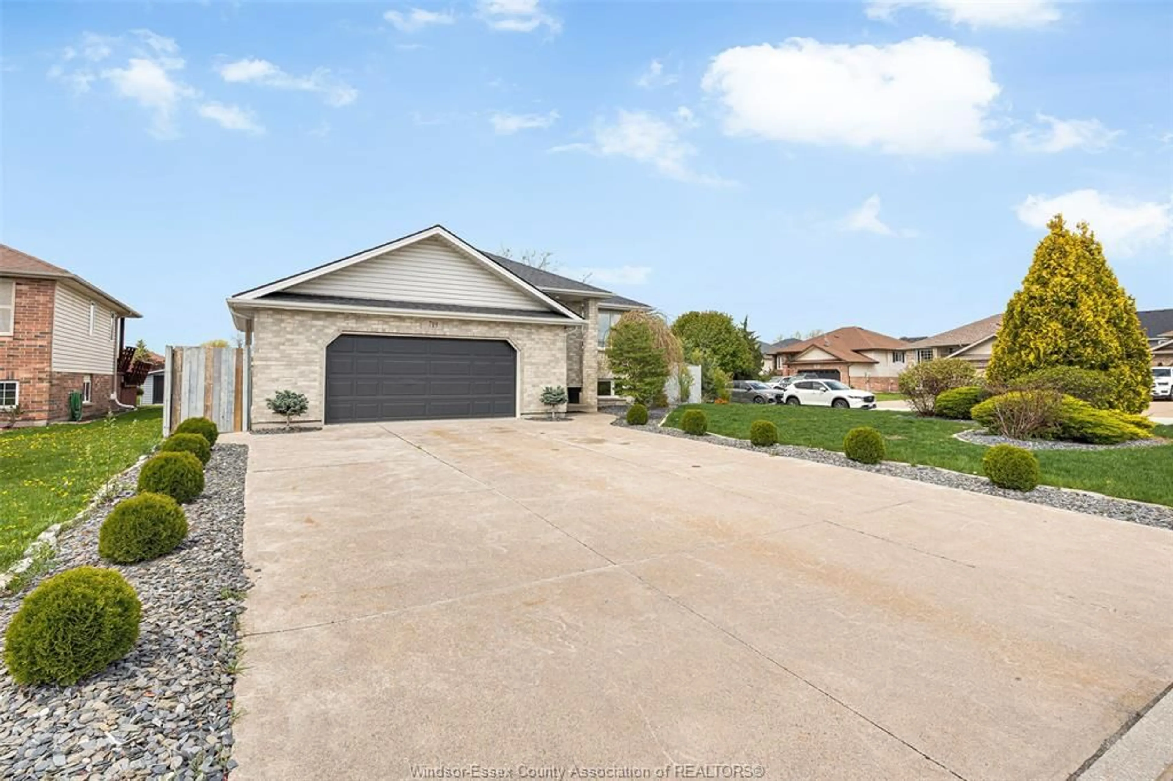 A pic from outside/outdoor area/front of a property/back of a property/a pic from drone, street for 719 HELENA Cres, Belle River Ontario N8L 0P7