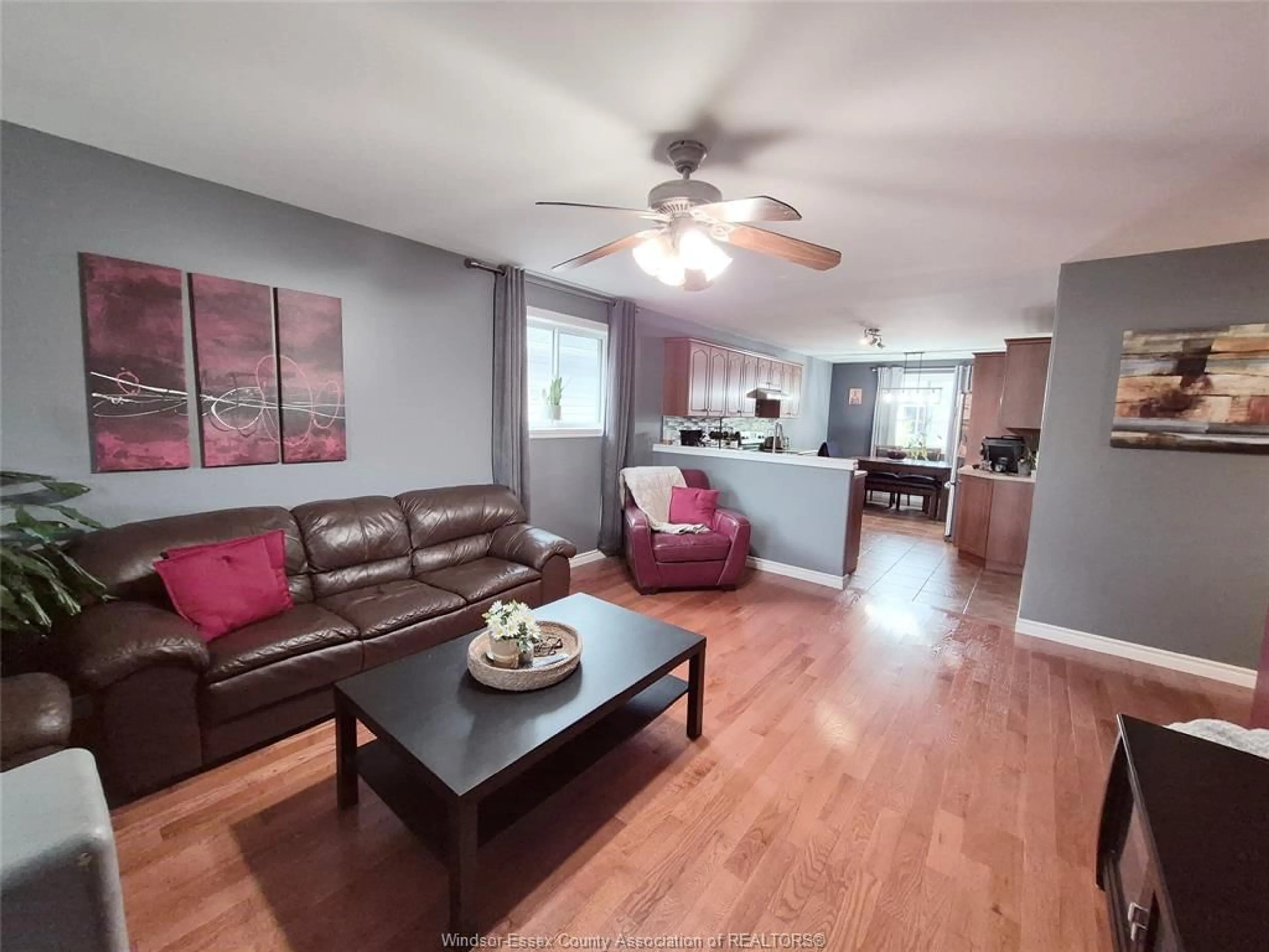 Living room with furniture, wood/laminate floor for 2514 DUNESHILL Ave, Windsor Ontario N8P 1Y2