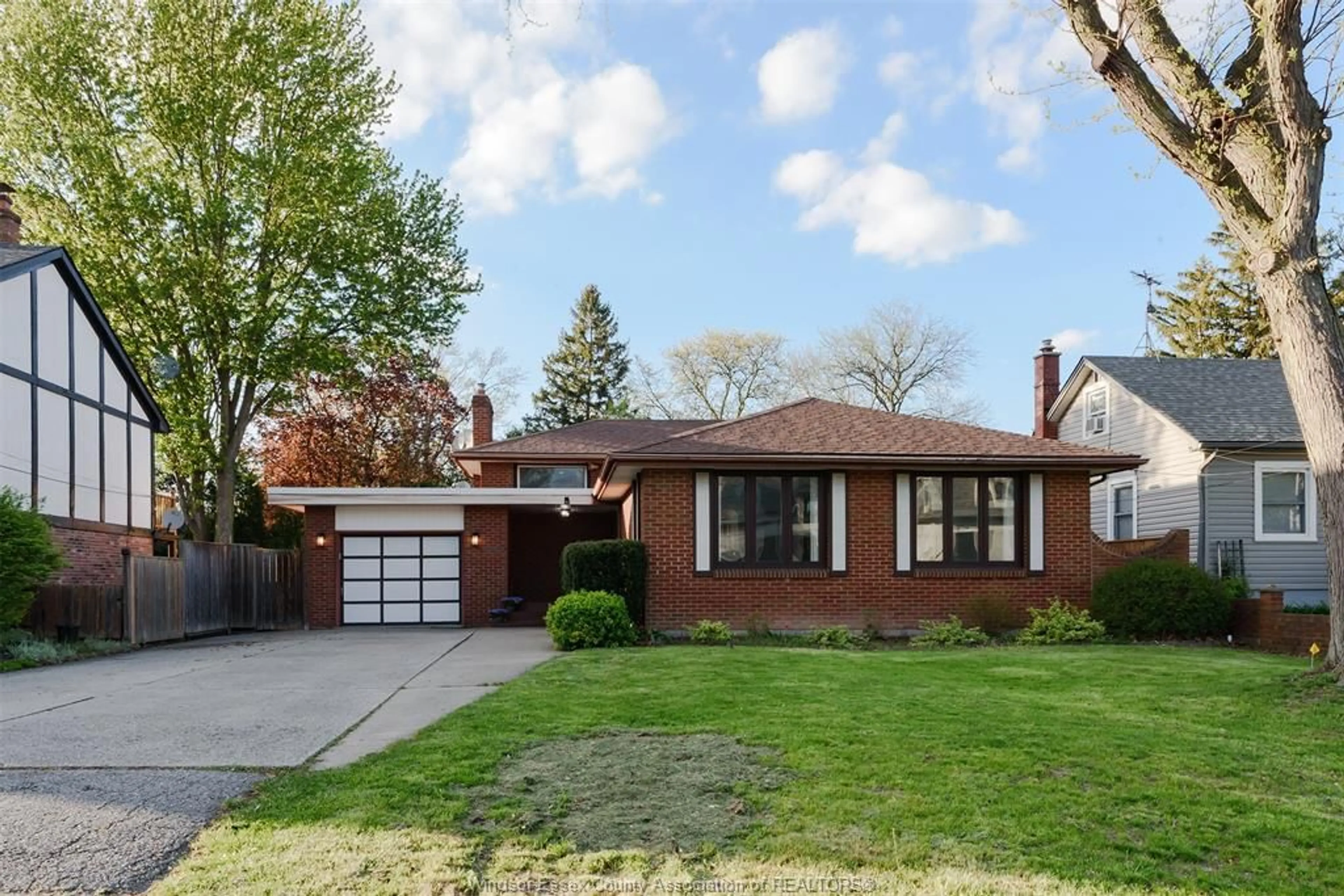 Home with brick exterior material, street for 740 KENNEDY Dr, Windsor Ontario N9G 1S9