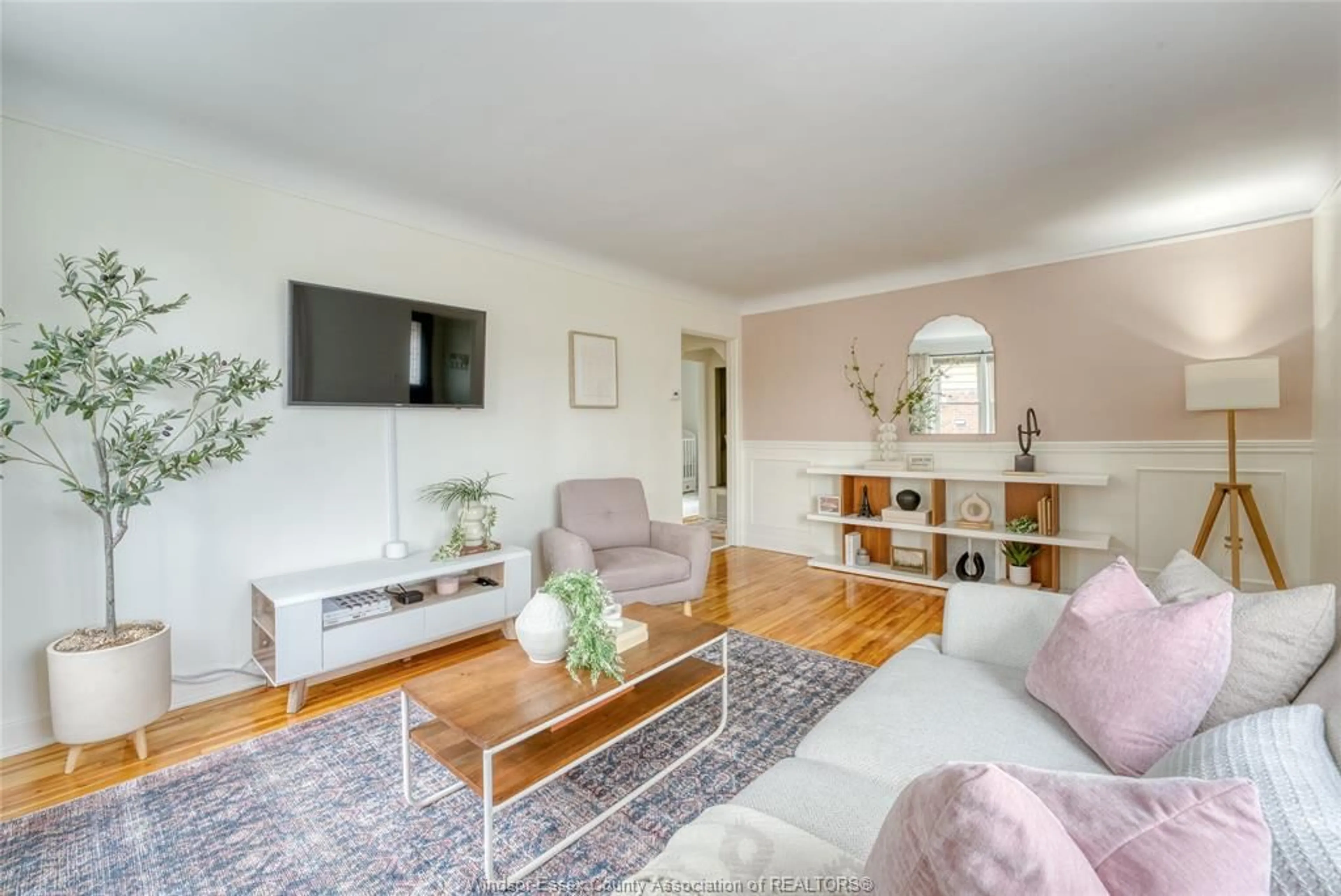 Living room with furniture, wood/laminate floor for 2431 CHILVER Rd, Windsor Ontario N8W 2V7