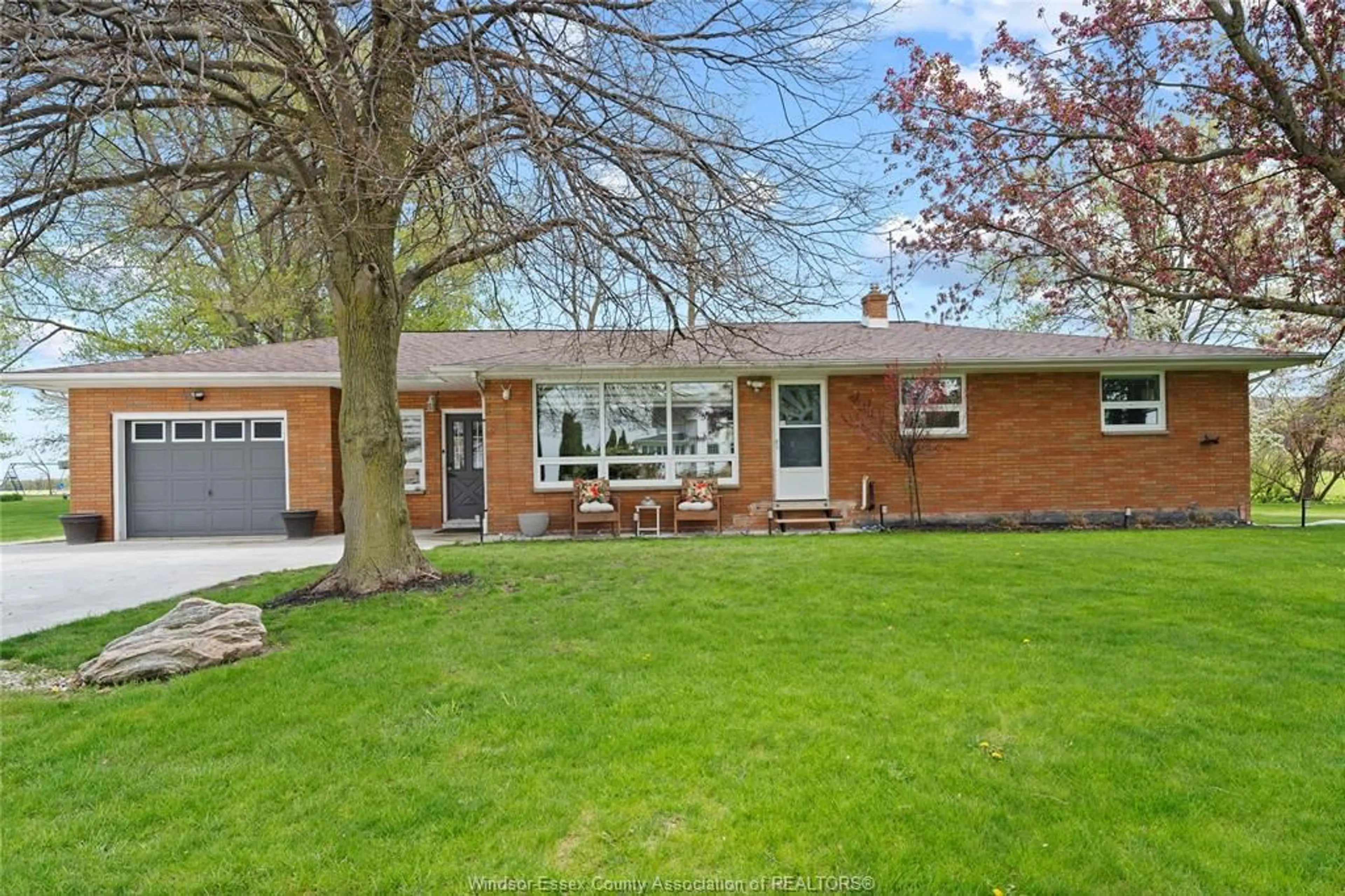 Home with brick exterior material, street for 418 TALBOT Rd, Leamington Ontario N8H 3V6