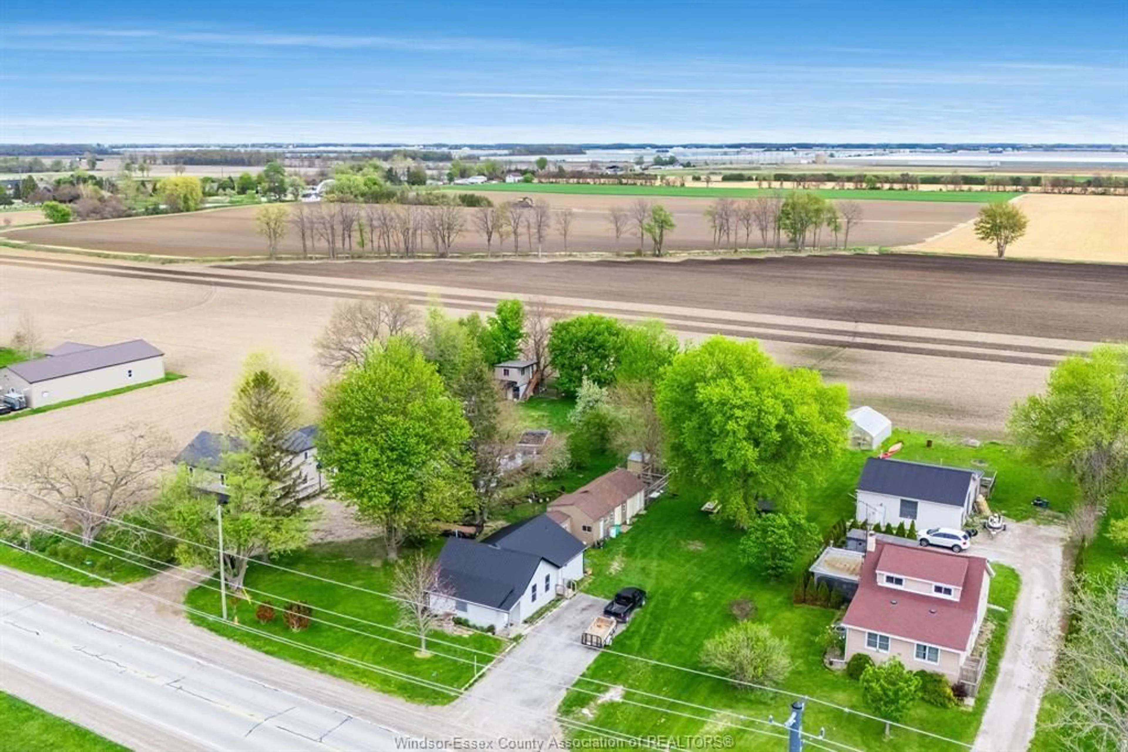 A pic from outside/outdoor area/front of a property/back of a property/a pic from drone, street for 850 County Road 31, Leamington Ontario N8H 3V8