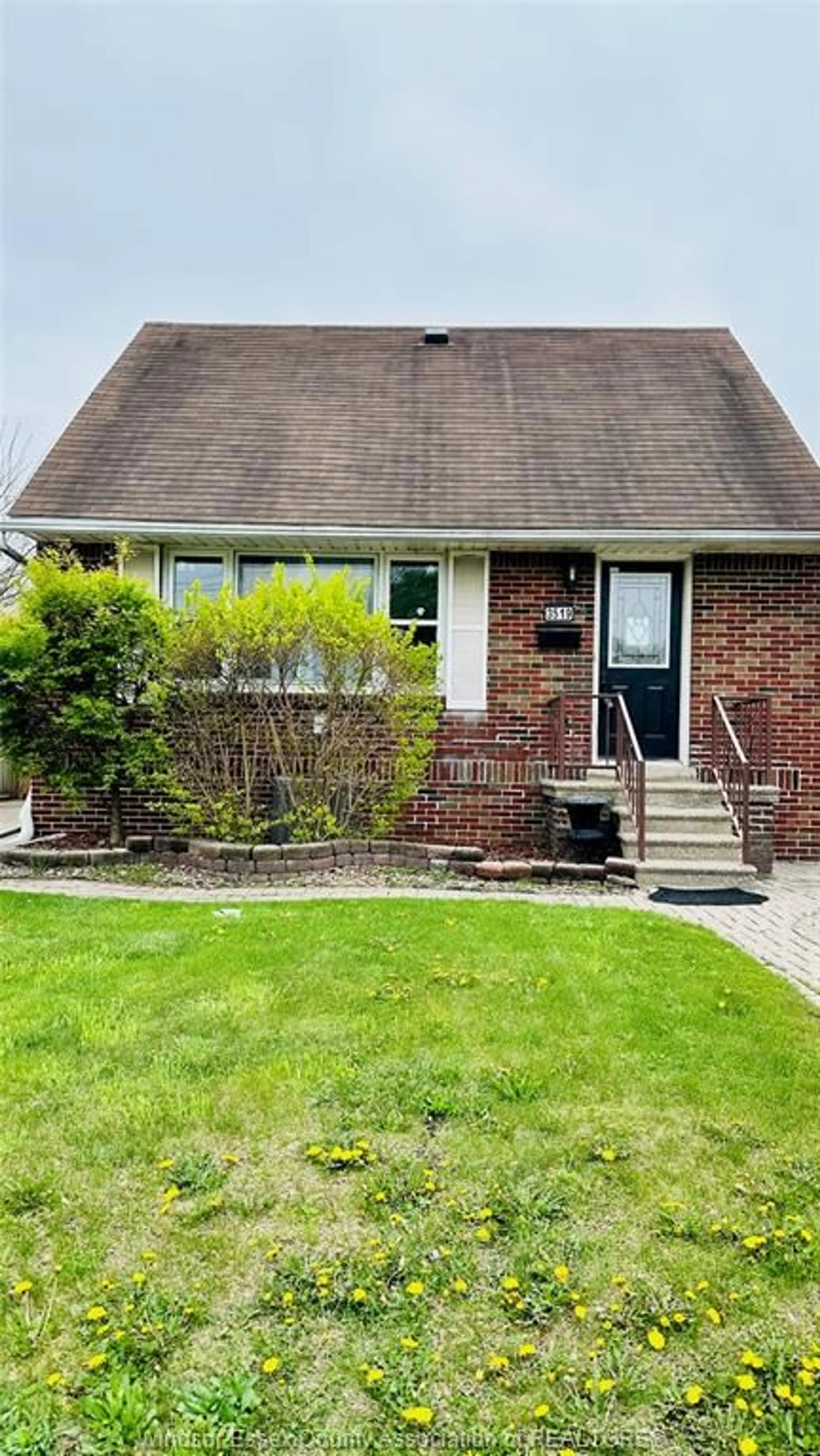 Home with brick exterior material, street for 3519 TECUMSEH Rd, Windsor Ontario N9C 2B6