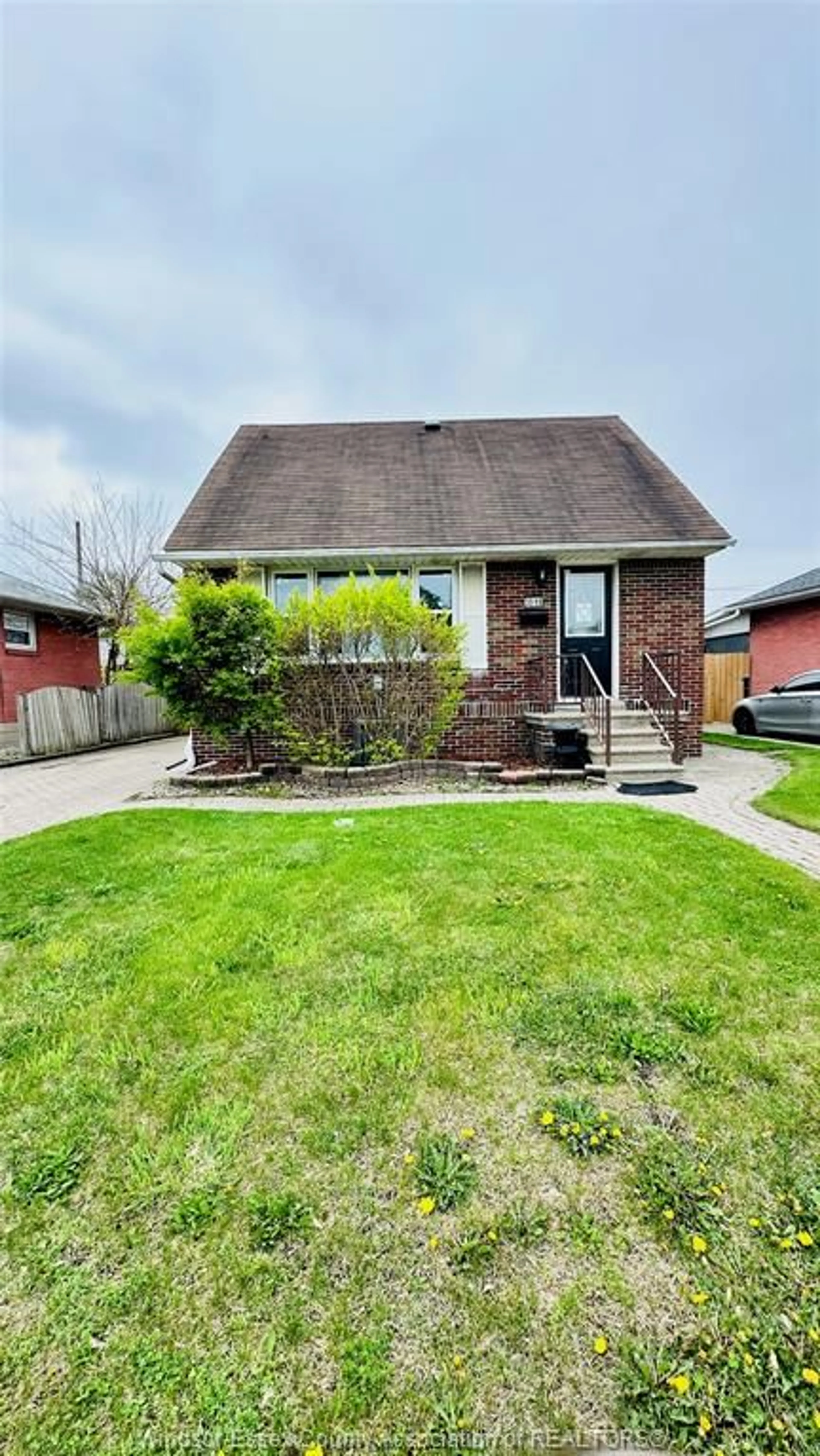 Home with brick exterior material, street for 3519 TECUMSEH Rd, Windsor Ontario N9C 2B6