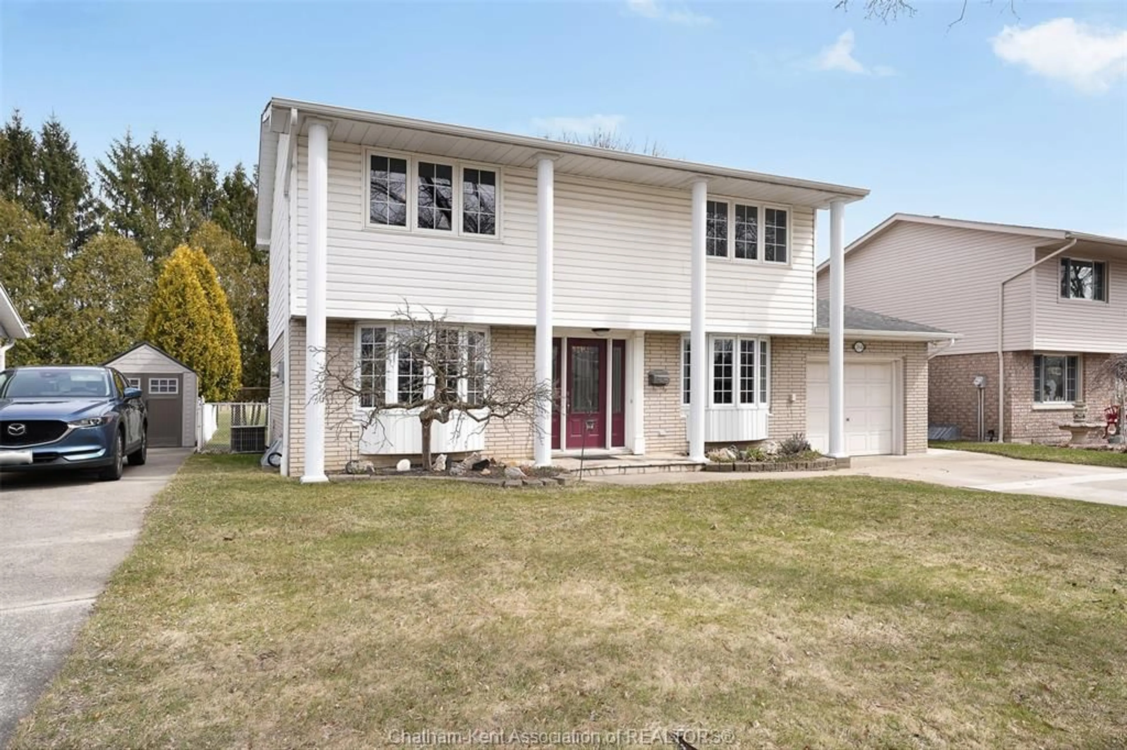 Home with vinyl exterior material, street for 264 Baldoon Rd, Chatham Ontario N7L 1E6