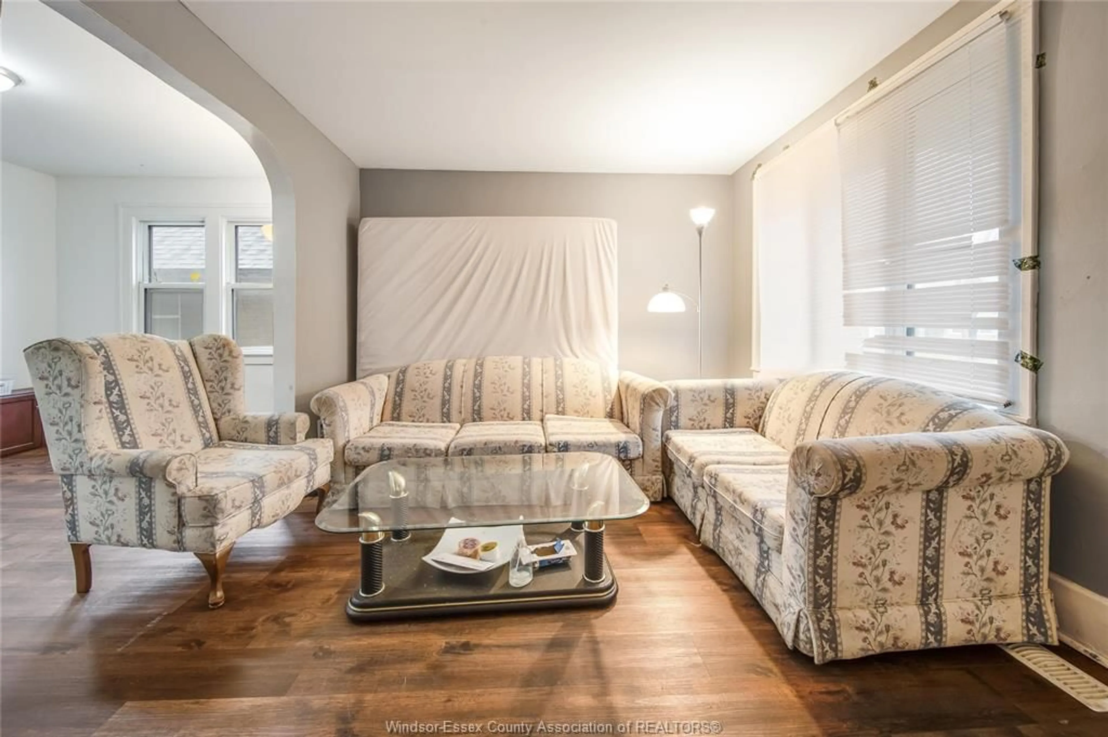 Living room with furniture, wood/laminate floor for 961 CURRY Ave, Windsor Ontario N9B 2C4