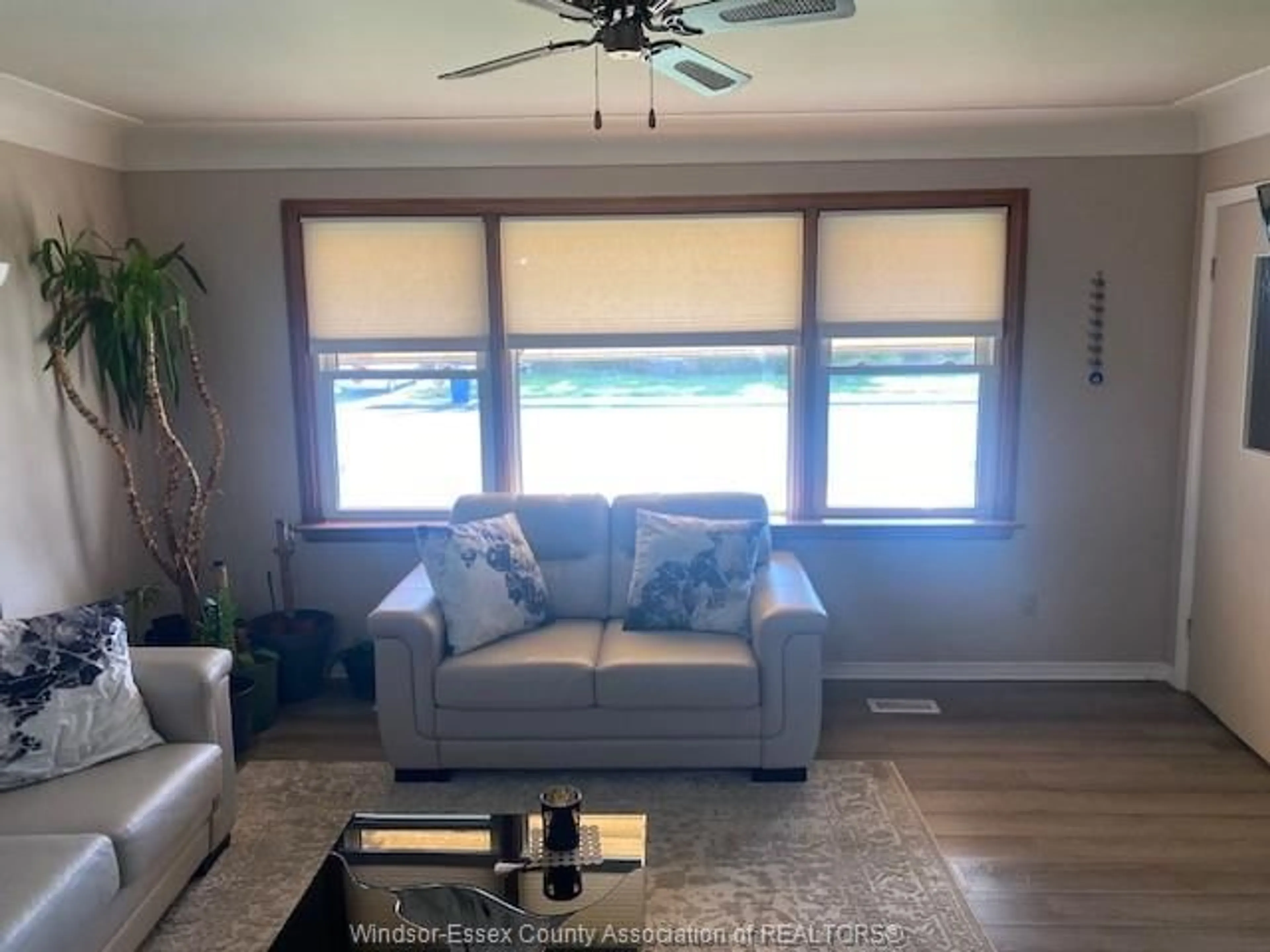 Living room with furniture, wood/laminate floor for 850 LAUZON, Windsor Ontario N8S 3M5