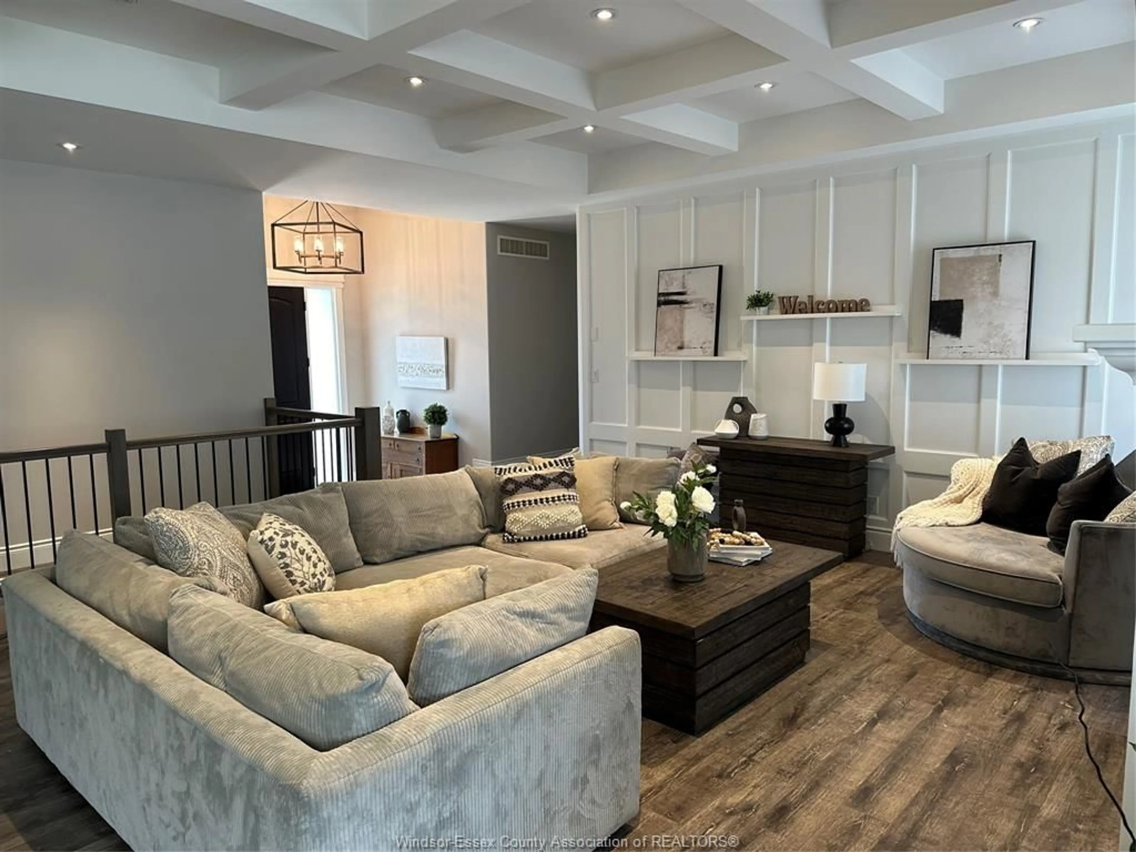 Living room with furniture, wood/laminate floor for 1694 Noah, Ruthven Ontario N0P 2G0