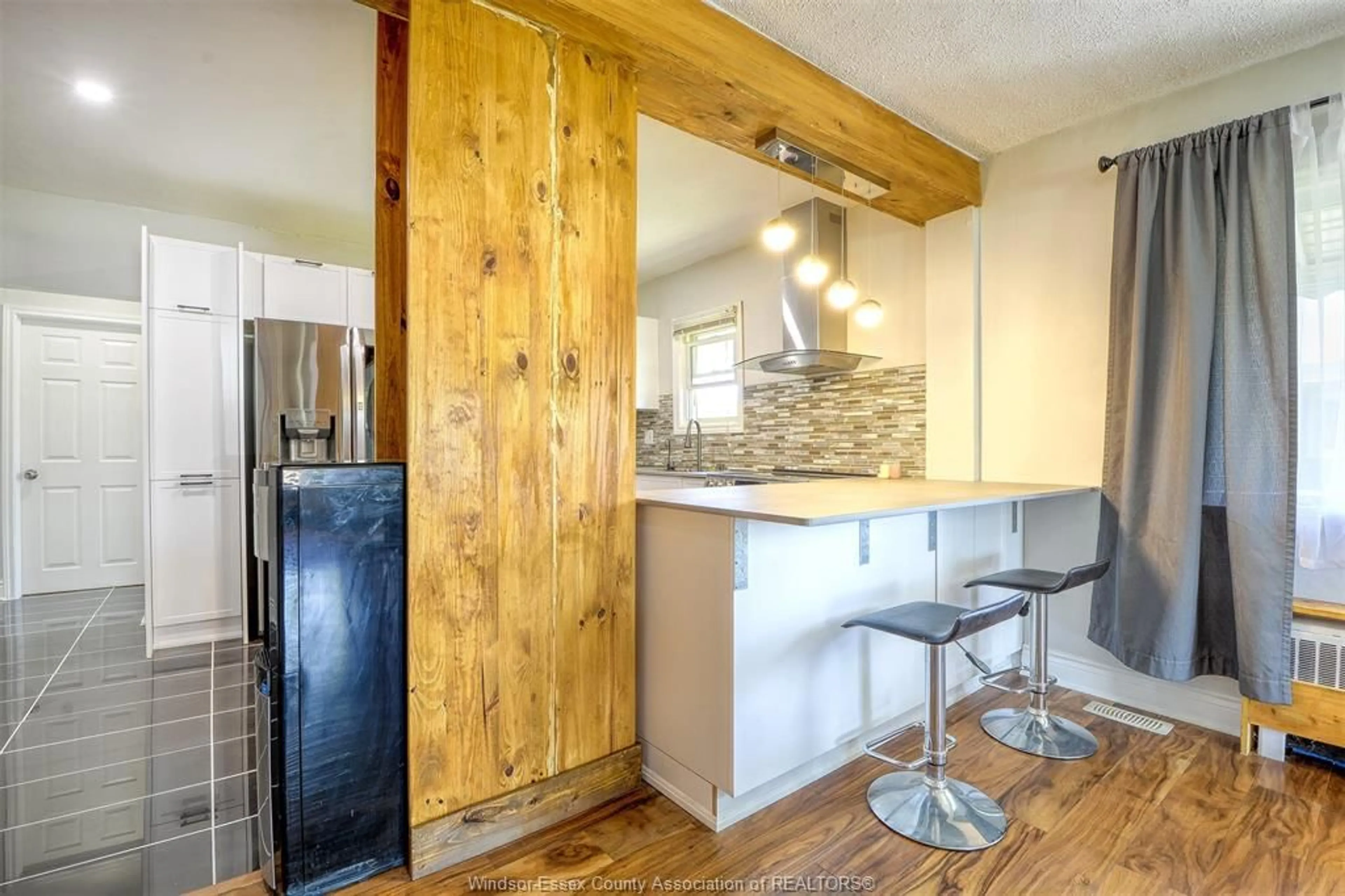 Open concept kitchen, wood/laminate floor for 616 BENSETTE St, Windsor Ontario N8X 2Y7