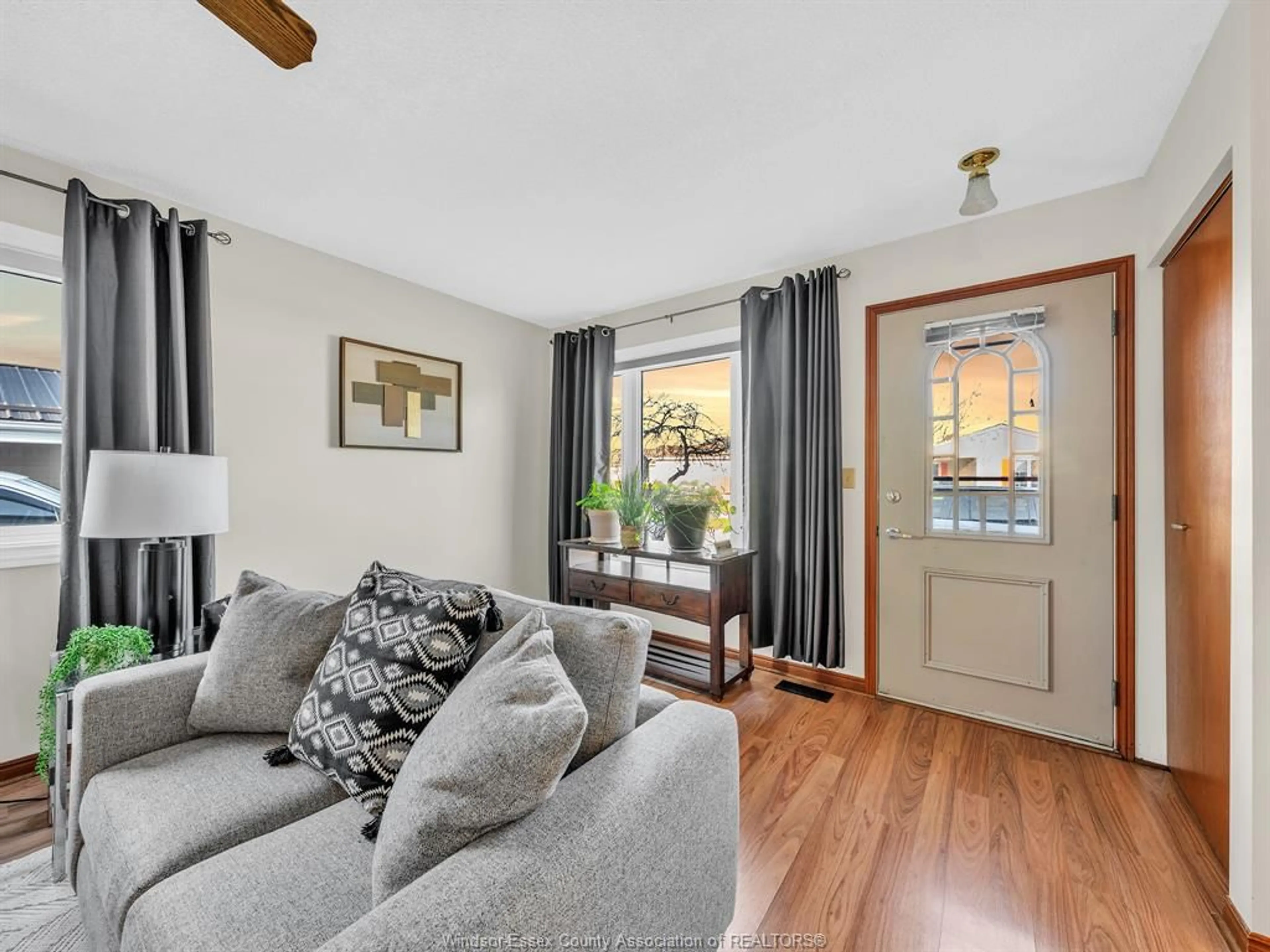 Living room with furniture, wood/laminate floor for 88 PARKSIDE, McGregor Ontario N0R 1J0