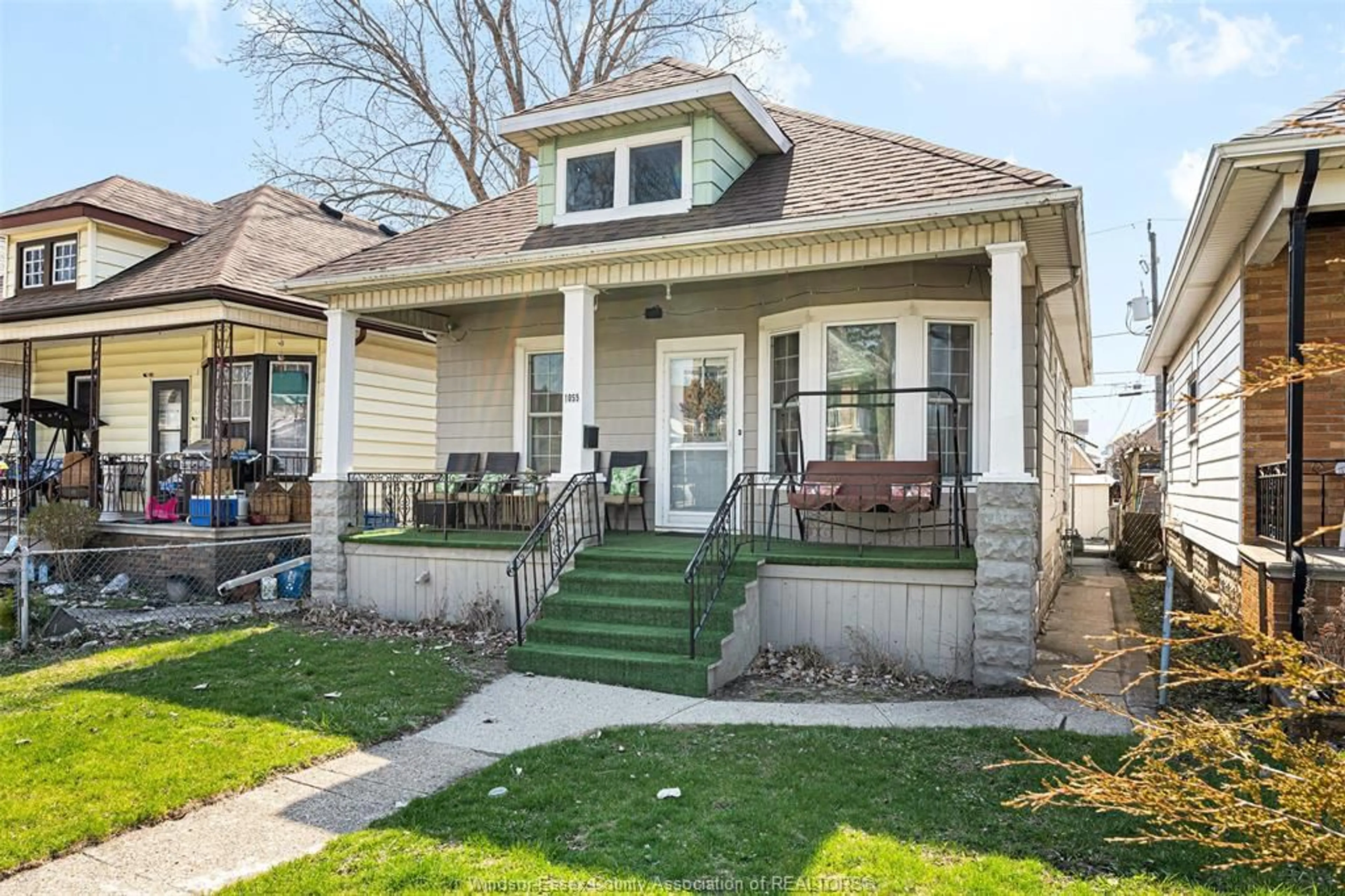 Home with vinyl exterior material, street for 1055 HALL, Windsor Ontario N9A 2M6