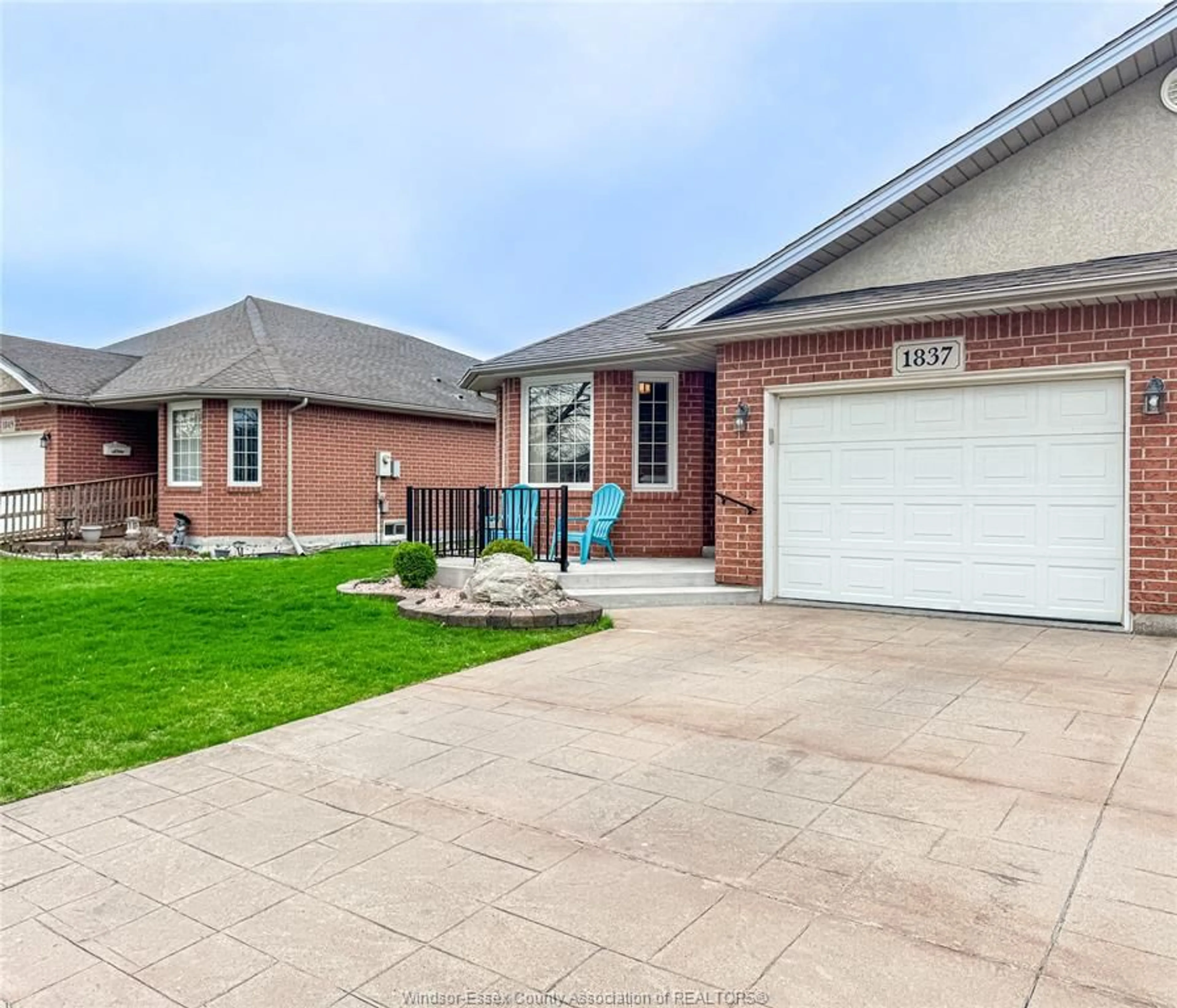 Home with brick exterior material, street for 1837 QUESTA Dr, Windsor Ontario N8P 1M5