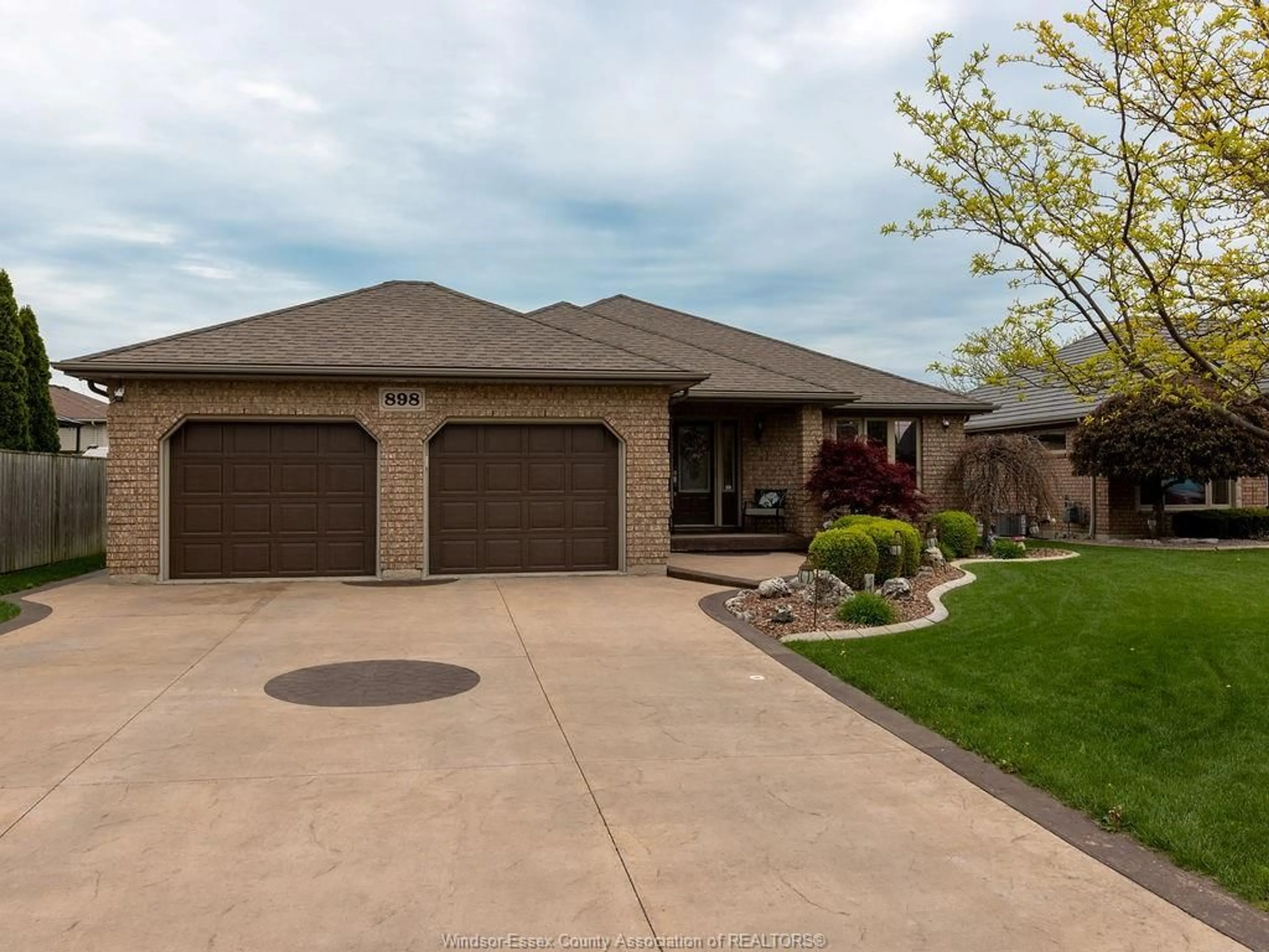 Home with brick exterior material, street for 898 SOUTHWOOD Dr, Lakeshore Ontario N8L 1G2