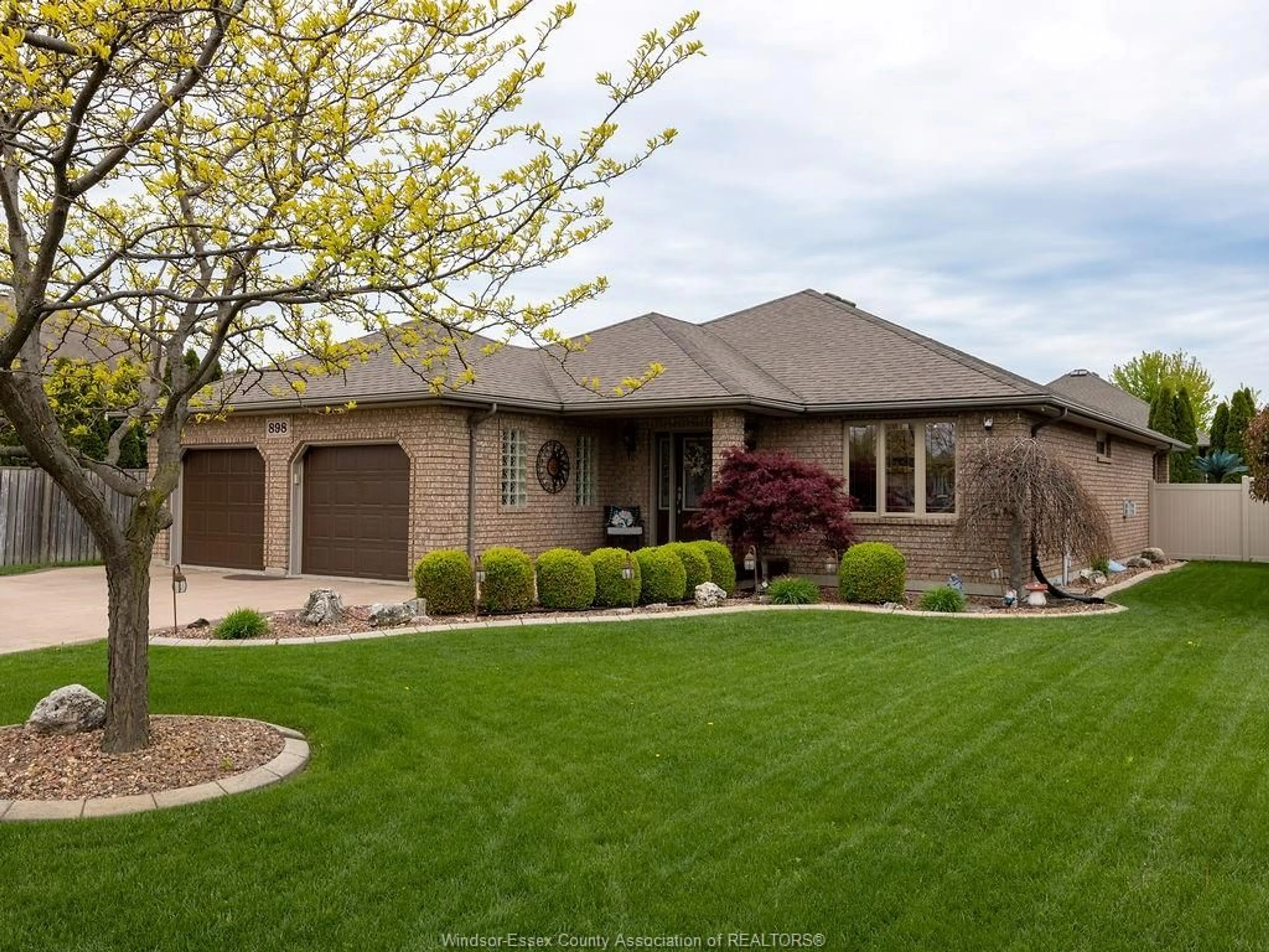 Home with brick exterior material, street for 898 SOUTHWOOD Dr, Lakeshore Ontario N8L 1G2