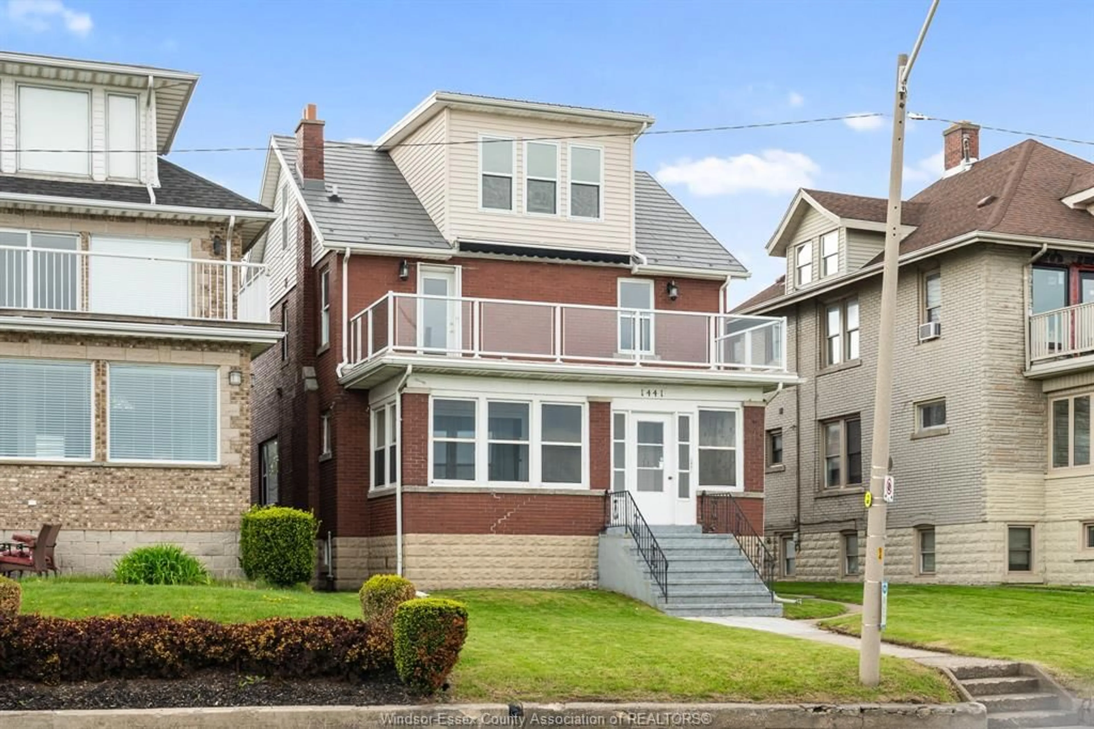 Home with vinyl exterior material, street for 1441 RIVERSIDE Dr, Windsor Ontario N9A 2T9