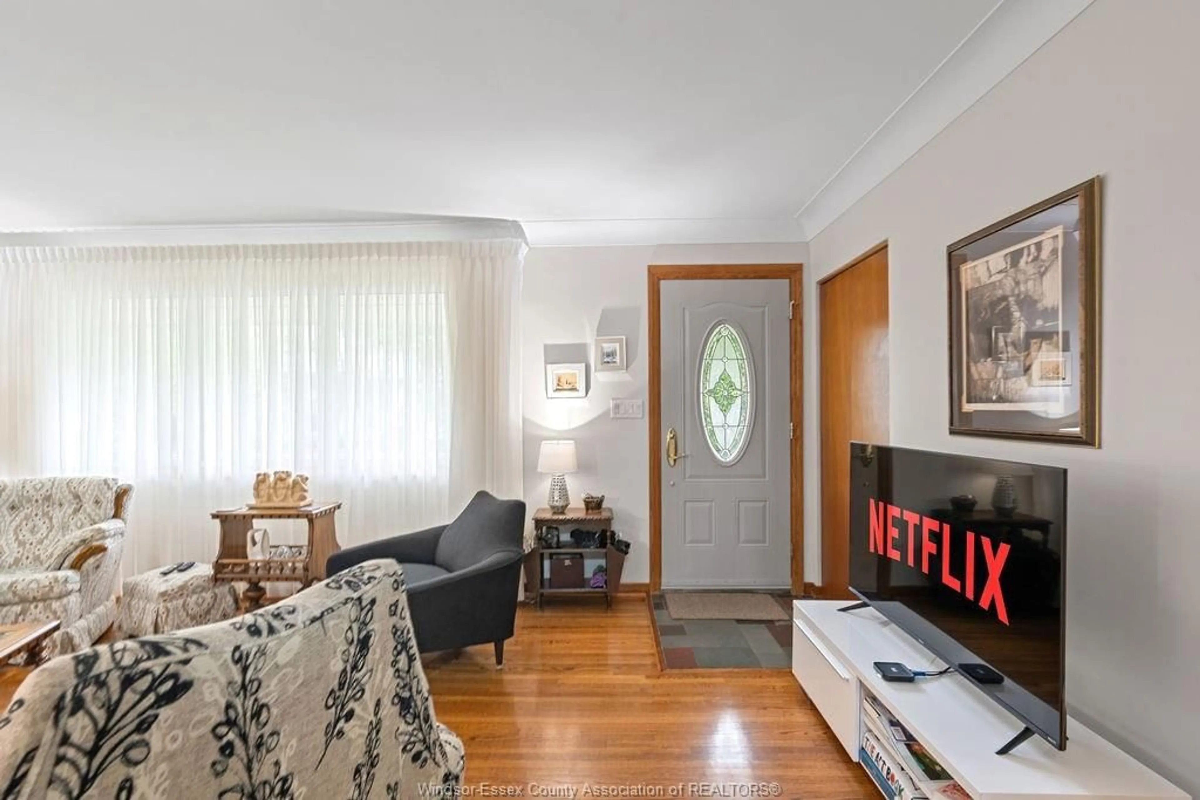 Living room with furniture, wood/laminate floor for 4018 Casgrain, Windsor Ontario N9G 2A5