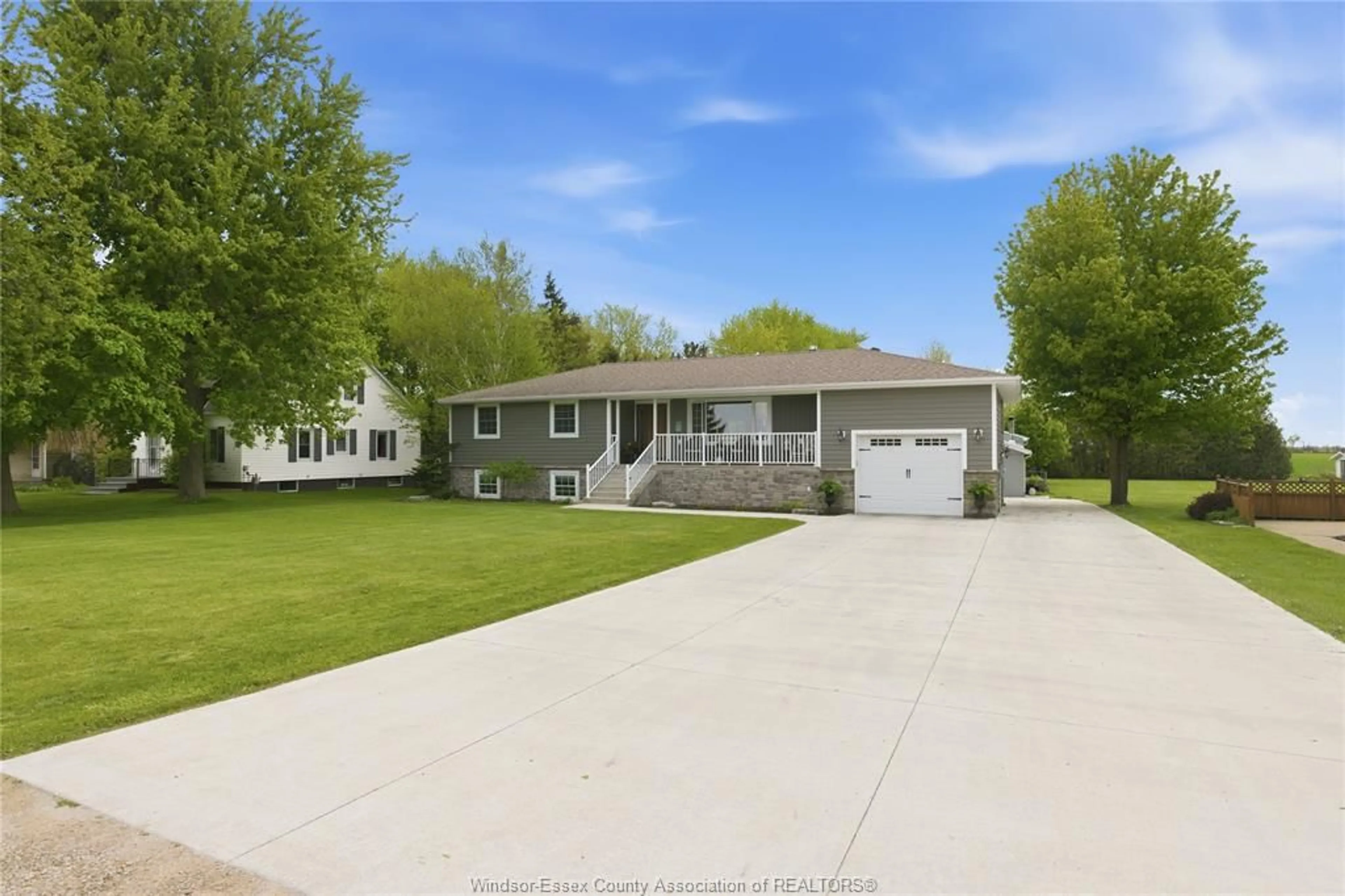 Home with vinyl exterior material, street for 215 COUNTY RD 34, Cottam Ontario N8M 2X5