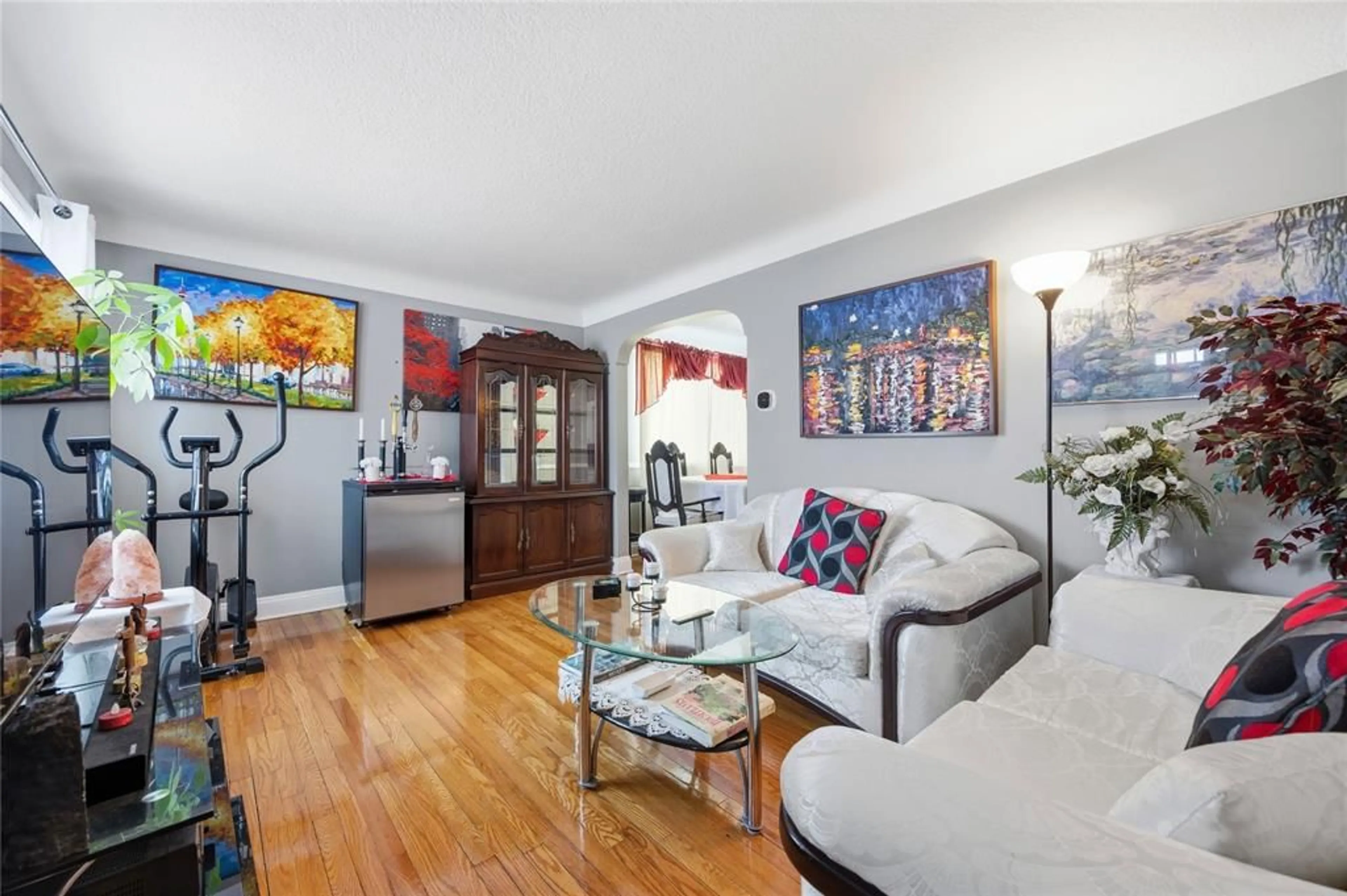 Living room with furniture, wood/laminate floor for 310 Conrad St, Sarnia Ontario N7T 3K6