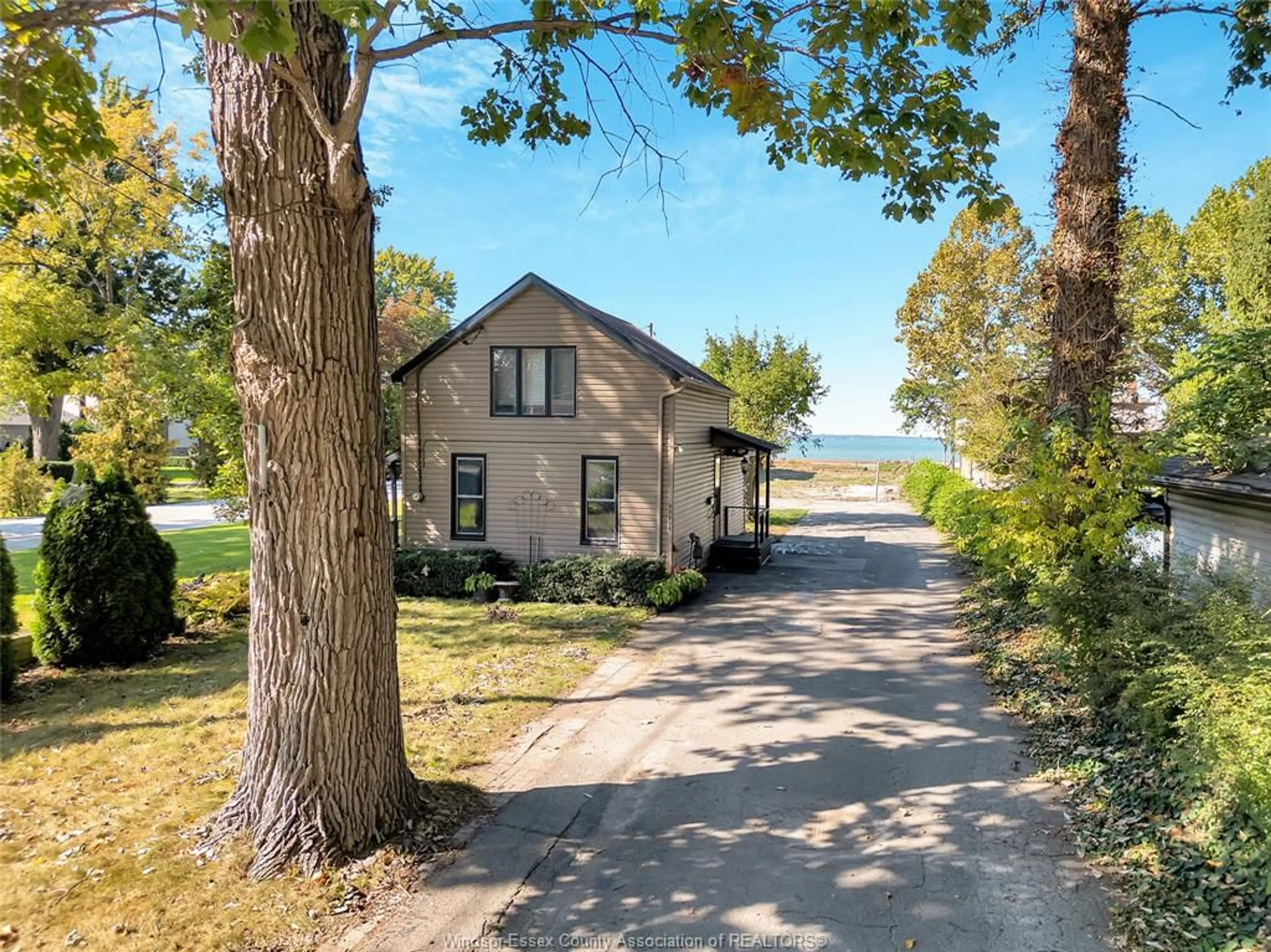 A pic from outside/outdoor area/front of a property/back of a property/a pic from drone, water/lake/river/ocean view for 12718-12722 RIVERSIDE Dr, Tecumseh Ontario N8N 1A7