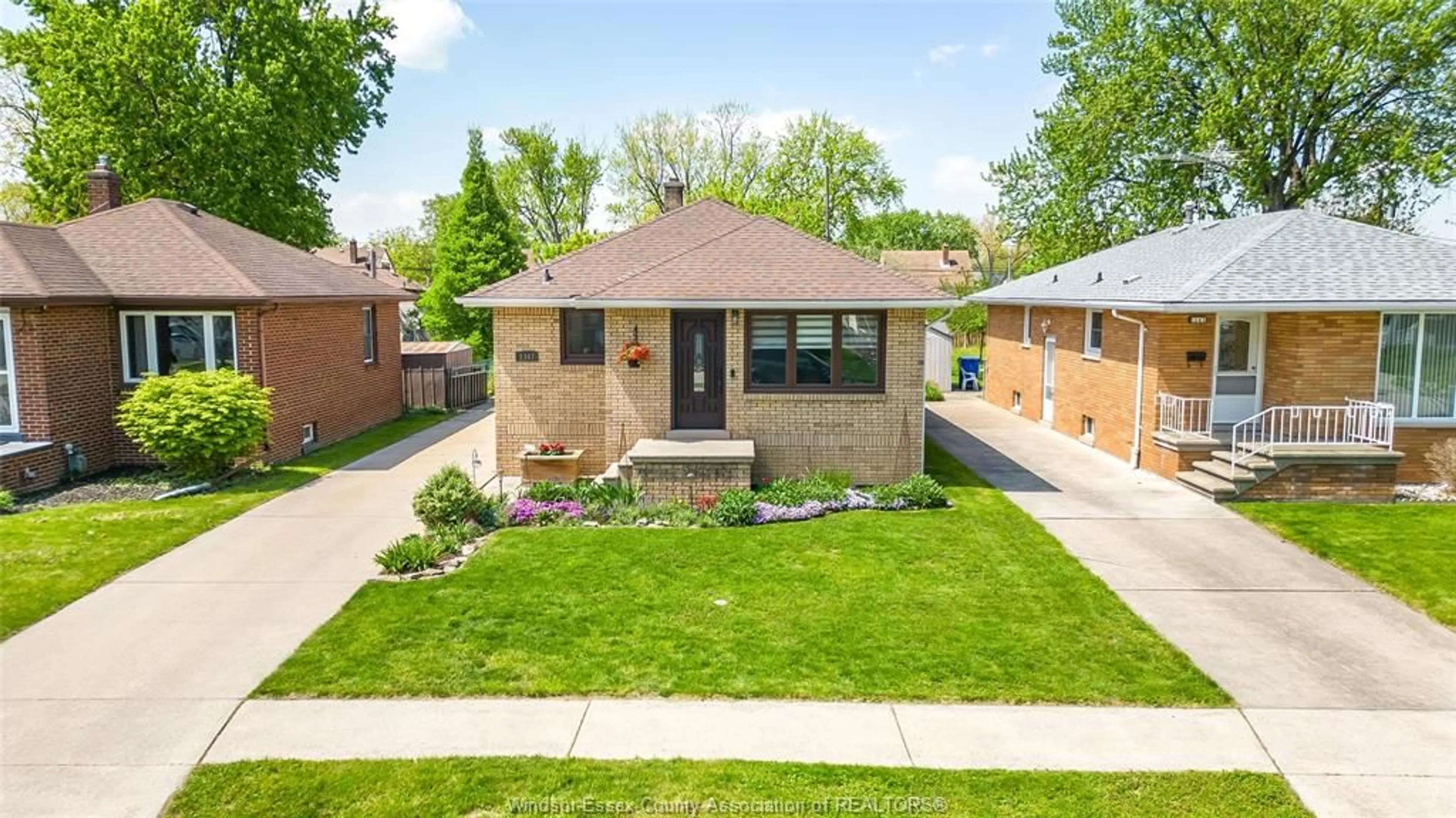 Home with brick exterior material, street for 1347 BERNARD Rd, Windsor Ontario N8Y 4K2