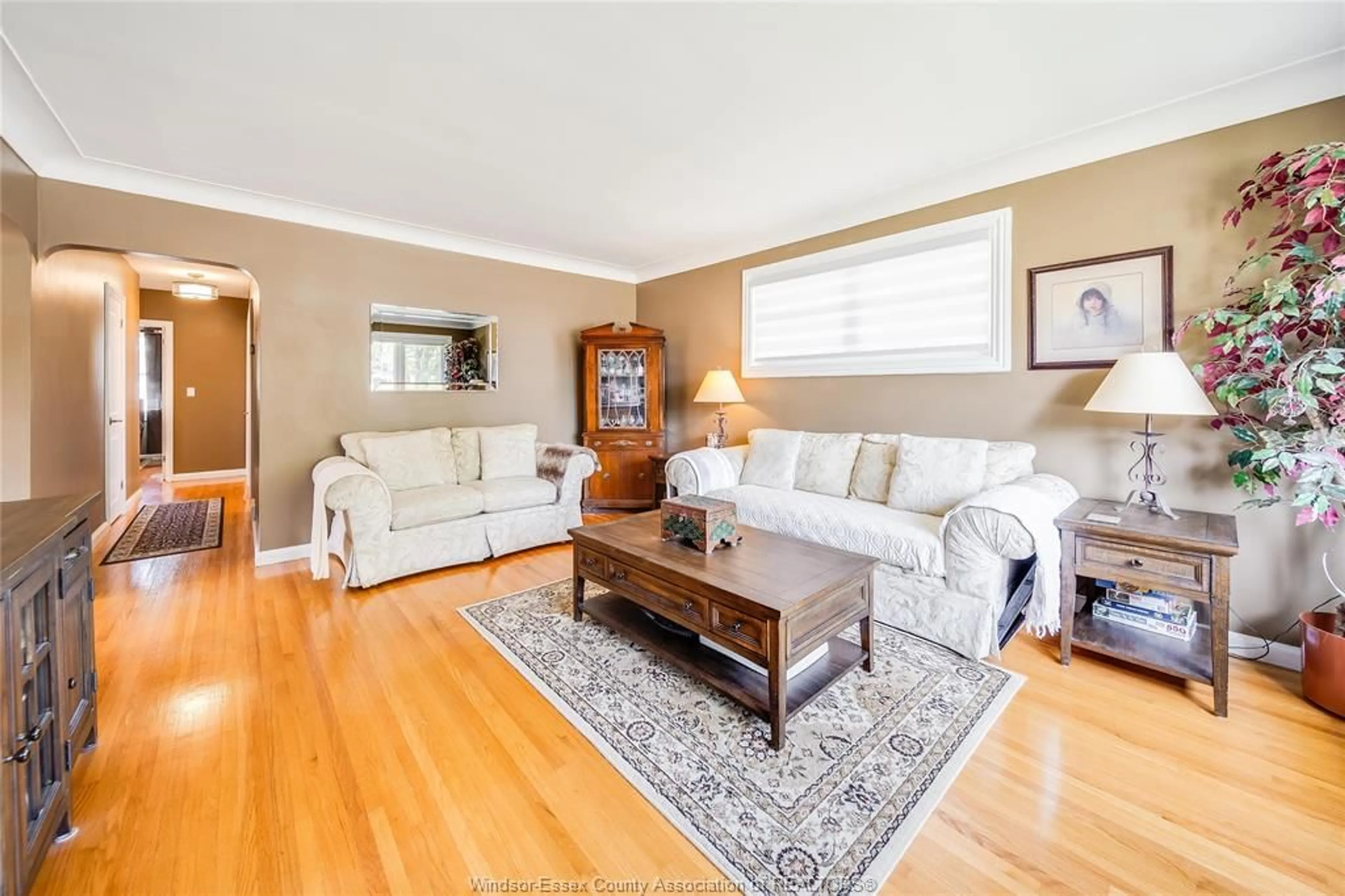 Living room with furniture, wood/laminate floor for 1347 BERNARD Rd, Windsor Ontario N8Y 4K2