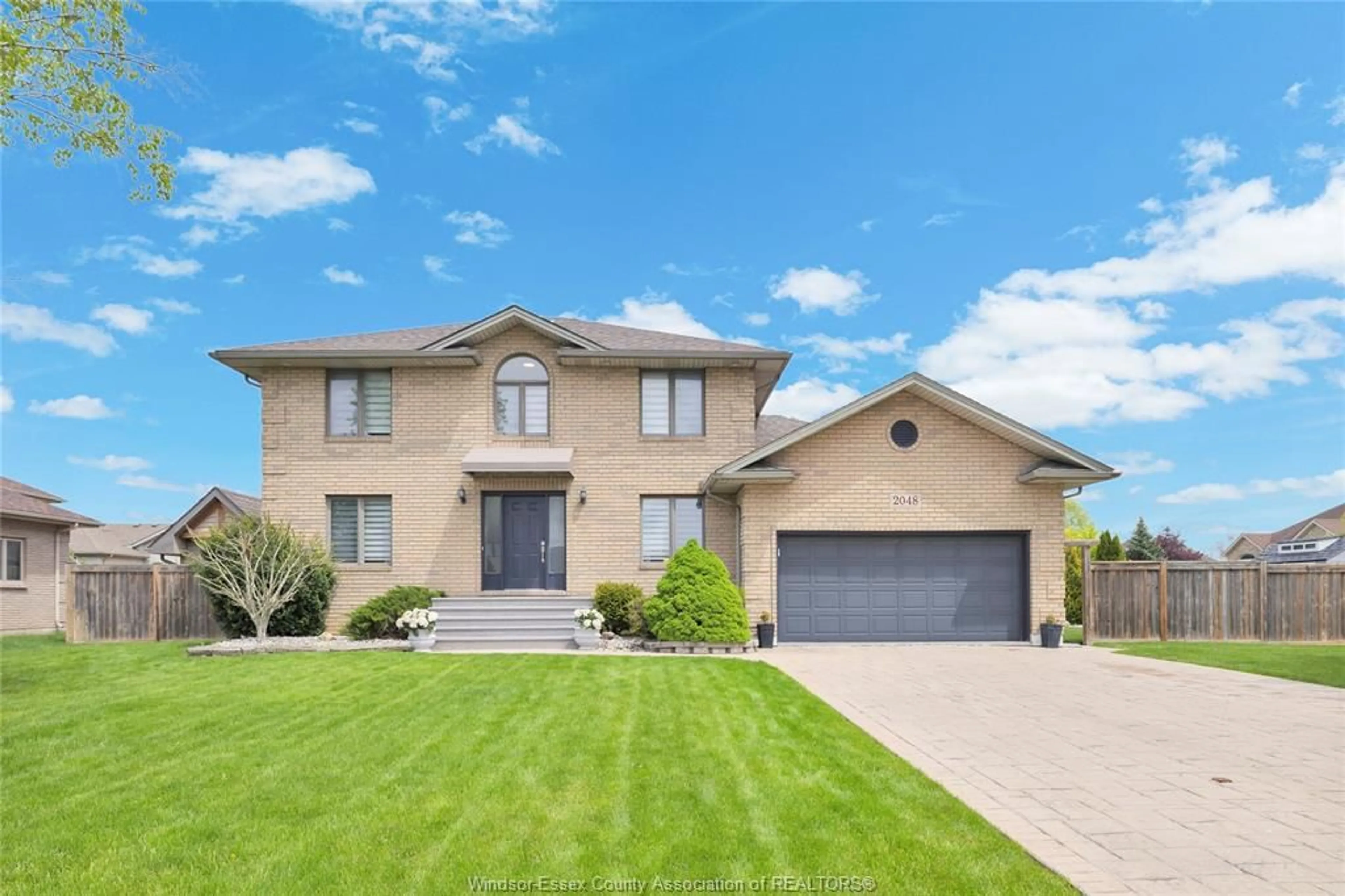 Home with brick exterior material, street for 2048 Eugeni, Tecumseh Ontario N9K 1B3