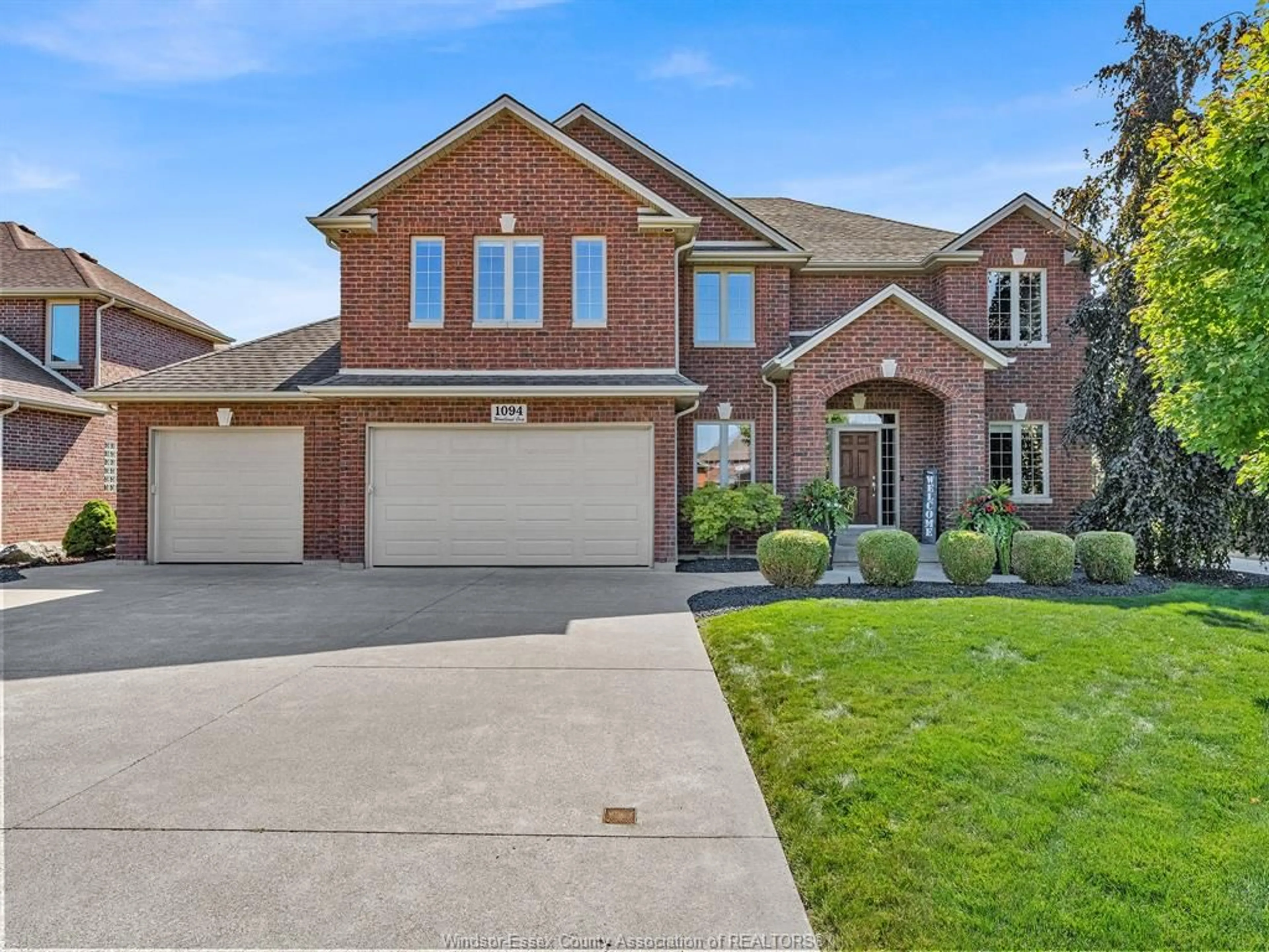 Home with brick exterior material, street for 1094 WOODLAND Cres, Lakeshore Ontario N0R 1A0