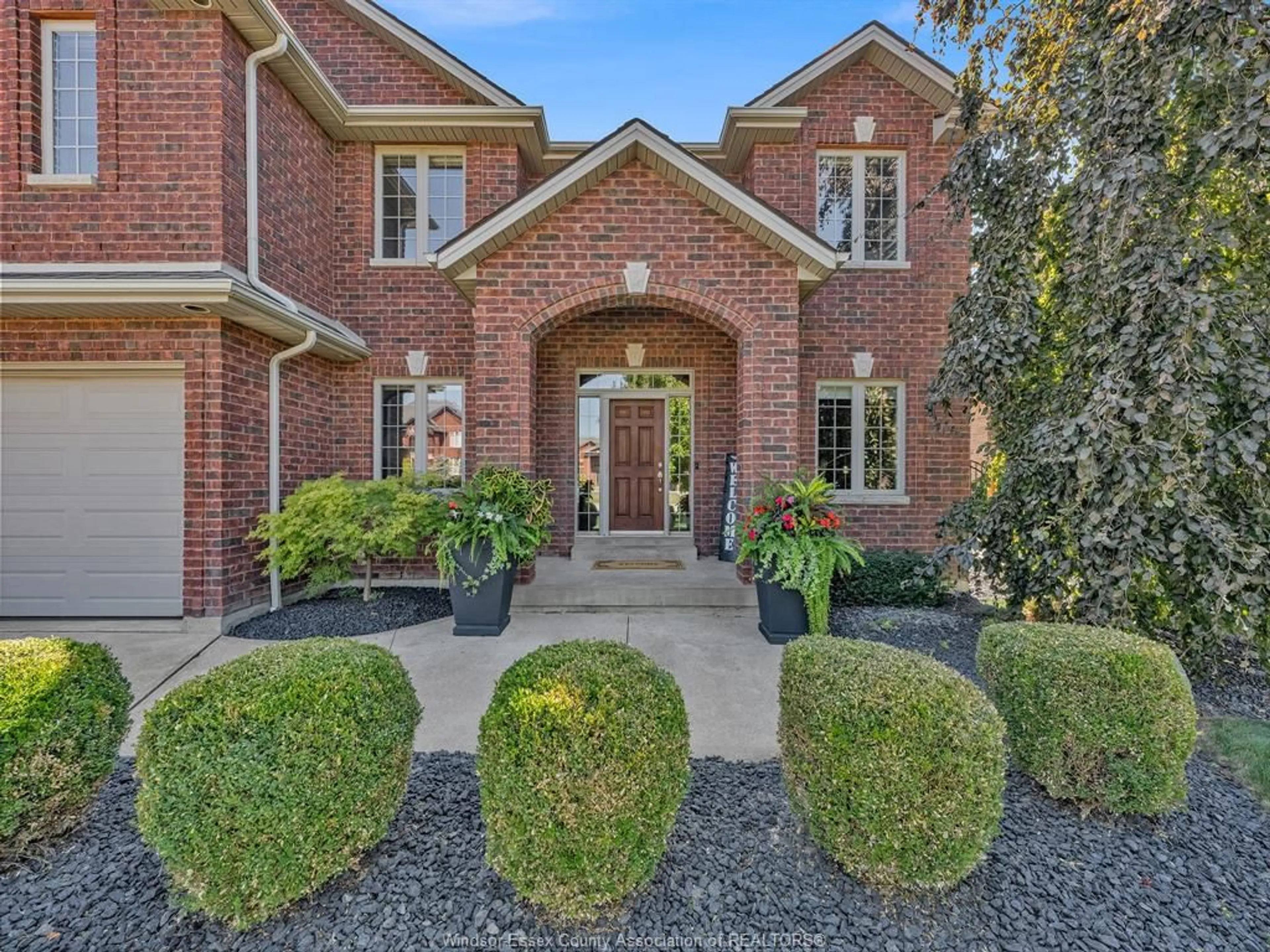 Home with brick exterior material, street for 1094 WOODLAND Cres, Lakeshore Ontario N0R 1A0