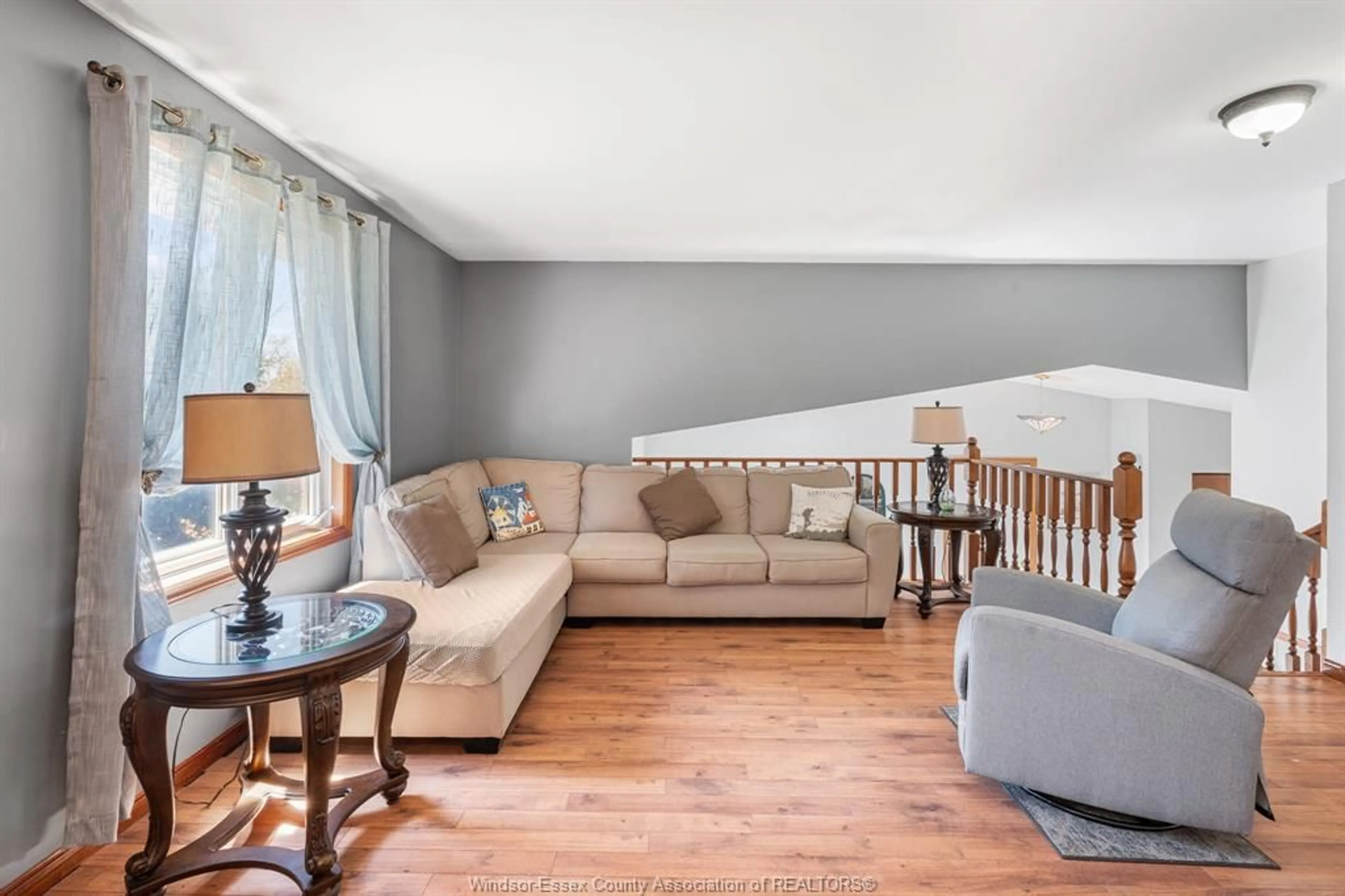 Living room with furniture, wood/laminate floor for 12510 LITTLE RIVER Blvd, Tecumseh Ontario N8N 4H3