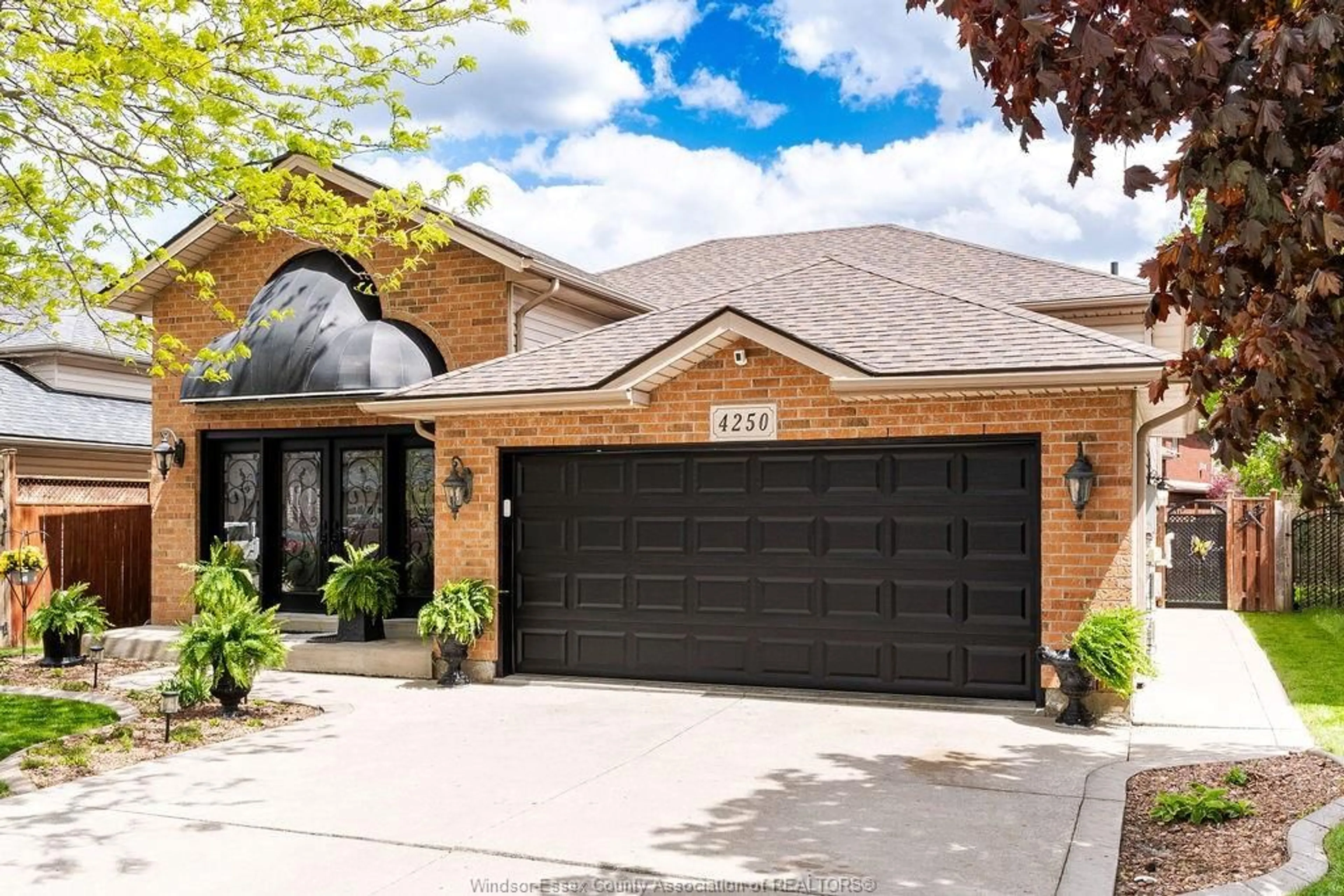 Home with brick exterior material, street for 4250 Canberra Ave, Windsor Ontario N9G 3E8