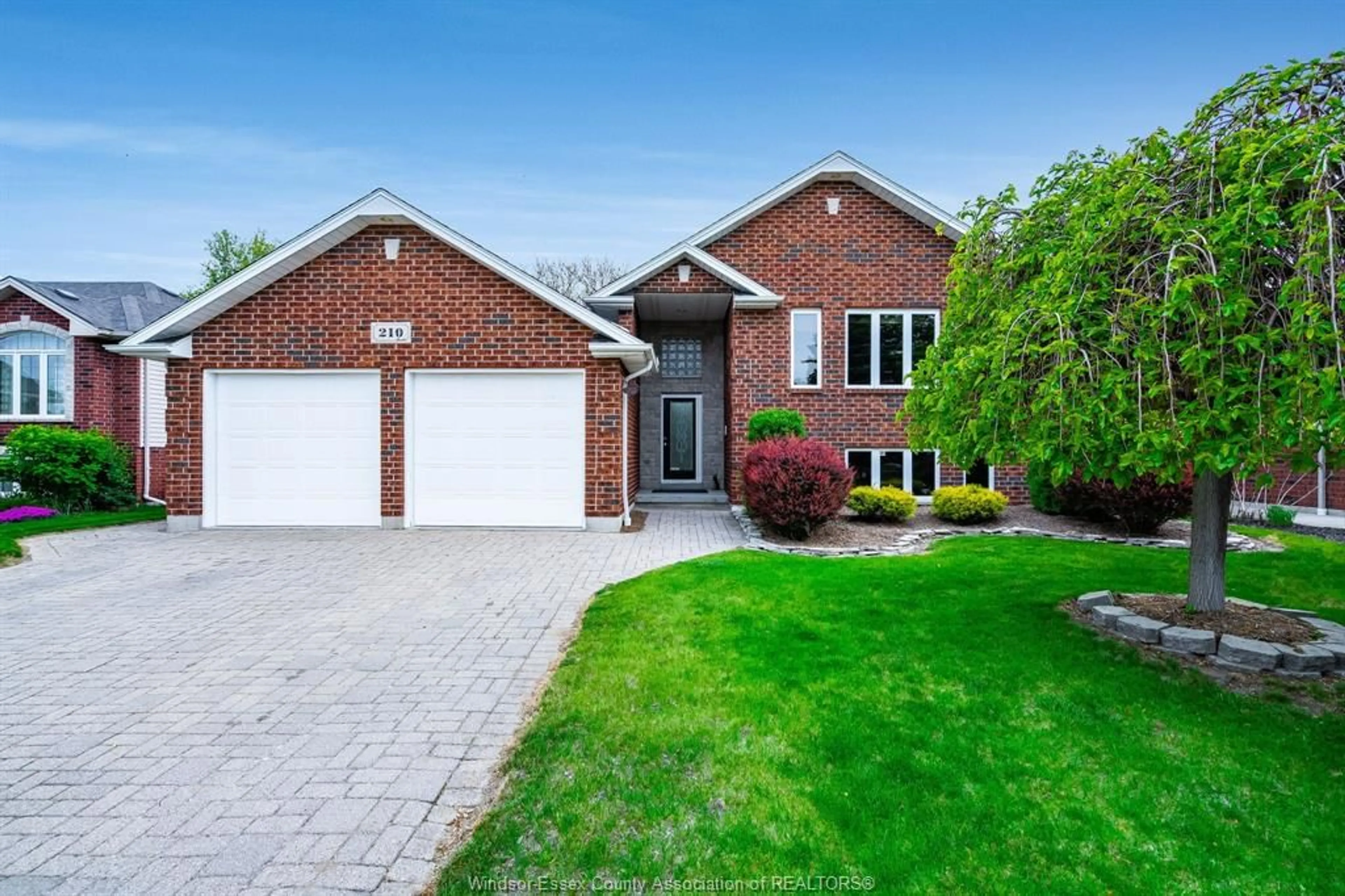 Home with brick exterior material, street for 210 Dieppe Cres, Kingsville Ontario N9Y 4B9