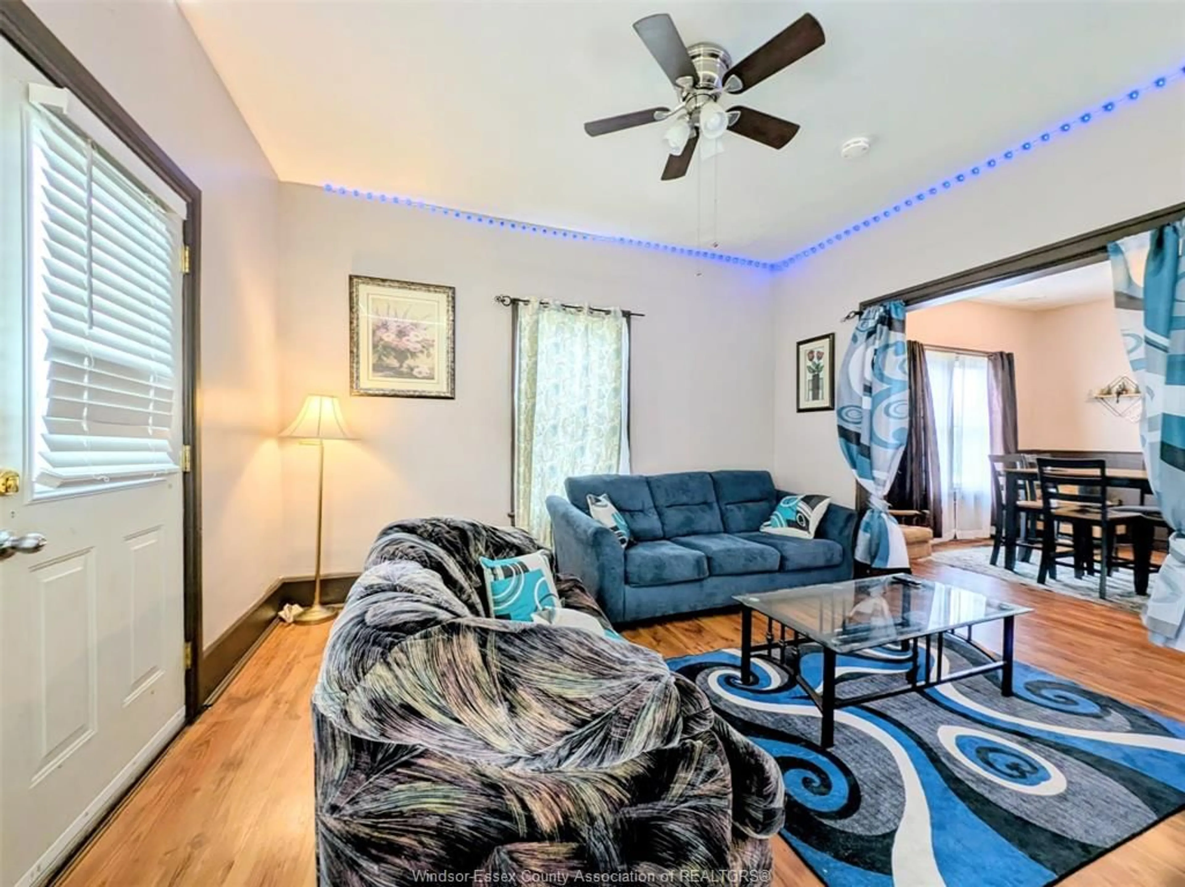 Living room with furniture, wood/laminate floor for 77 ASKEW, Leamington Ontario N8H 1Y1
