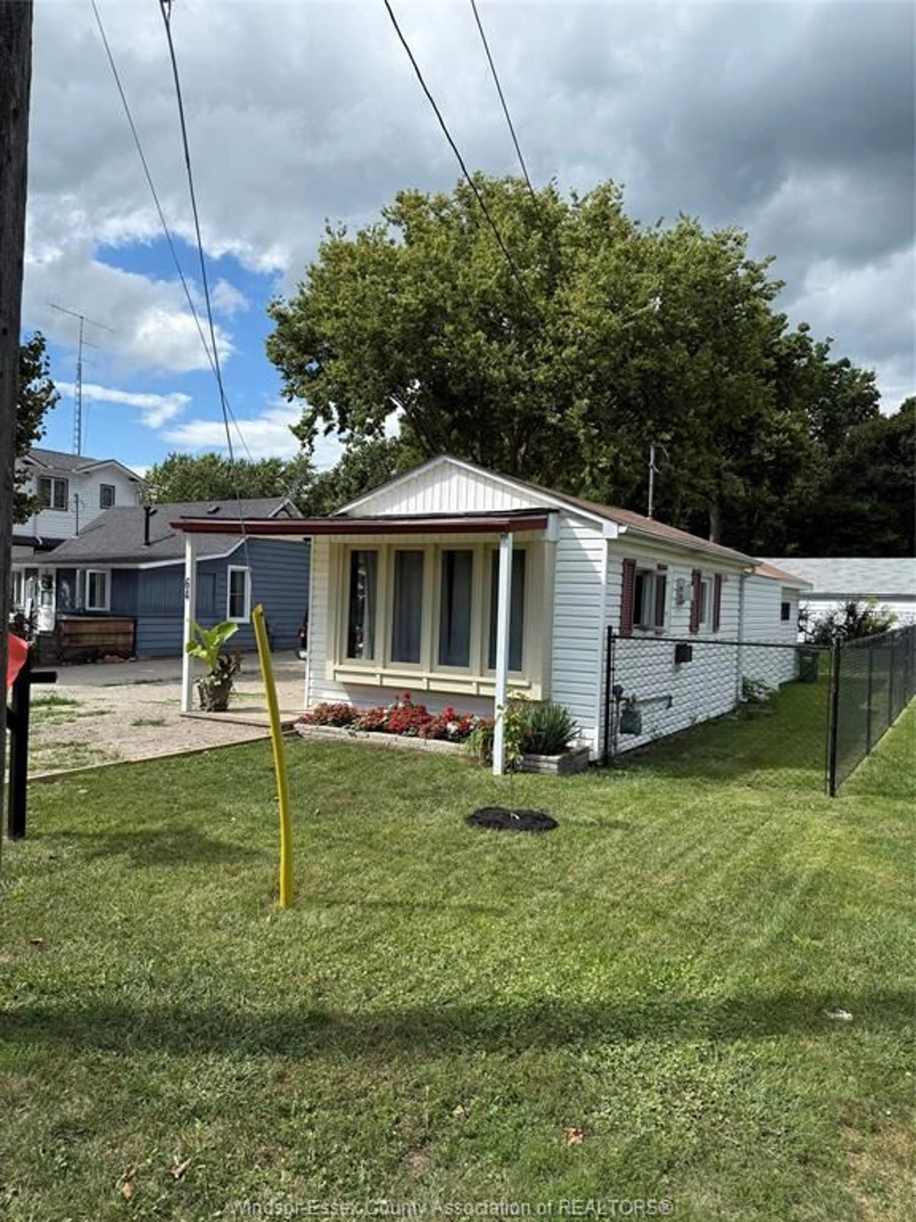 Home with vinyl exterior material, street for 64 COUNTY RD 50, Colchester South Ontario N0R 1G0
