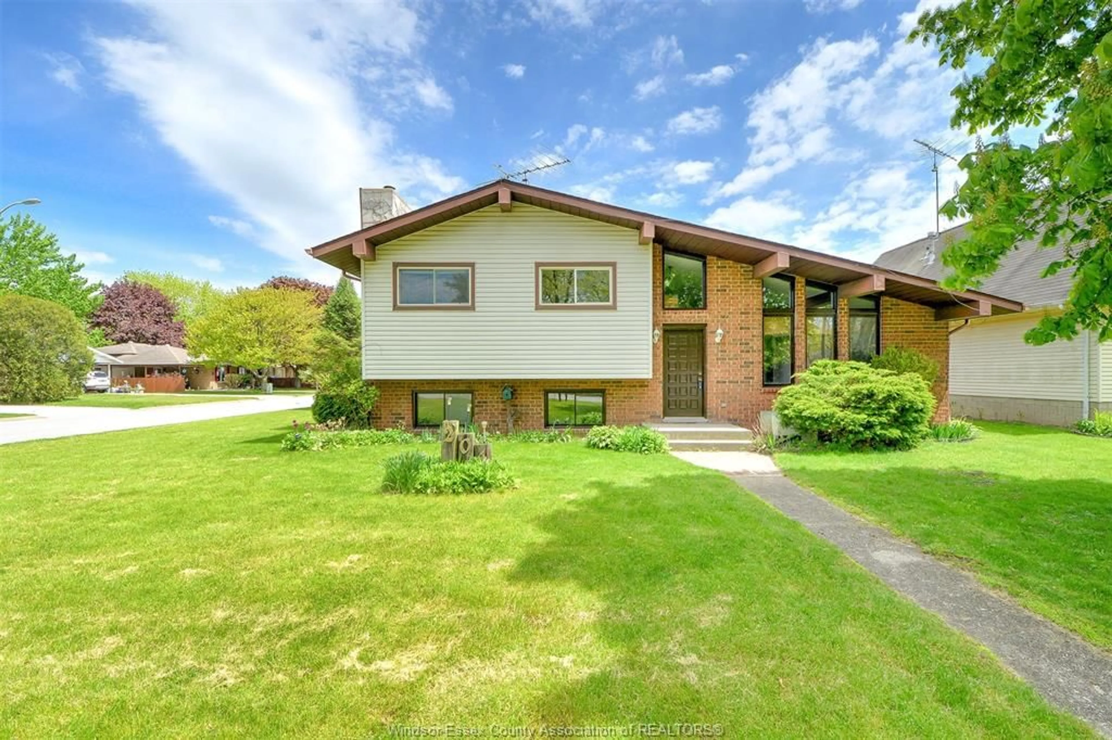 Home with brick exterior material, street for 204 PEARSON Dr, Harrow Ontario N0R 1G0