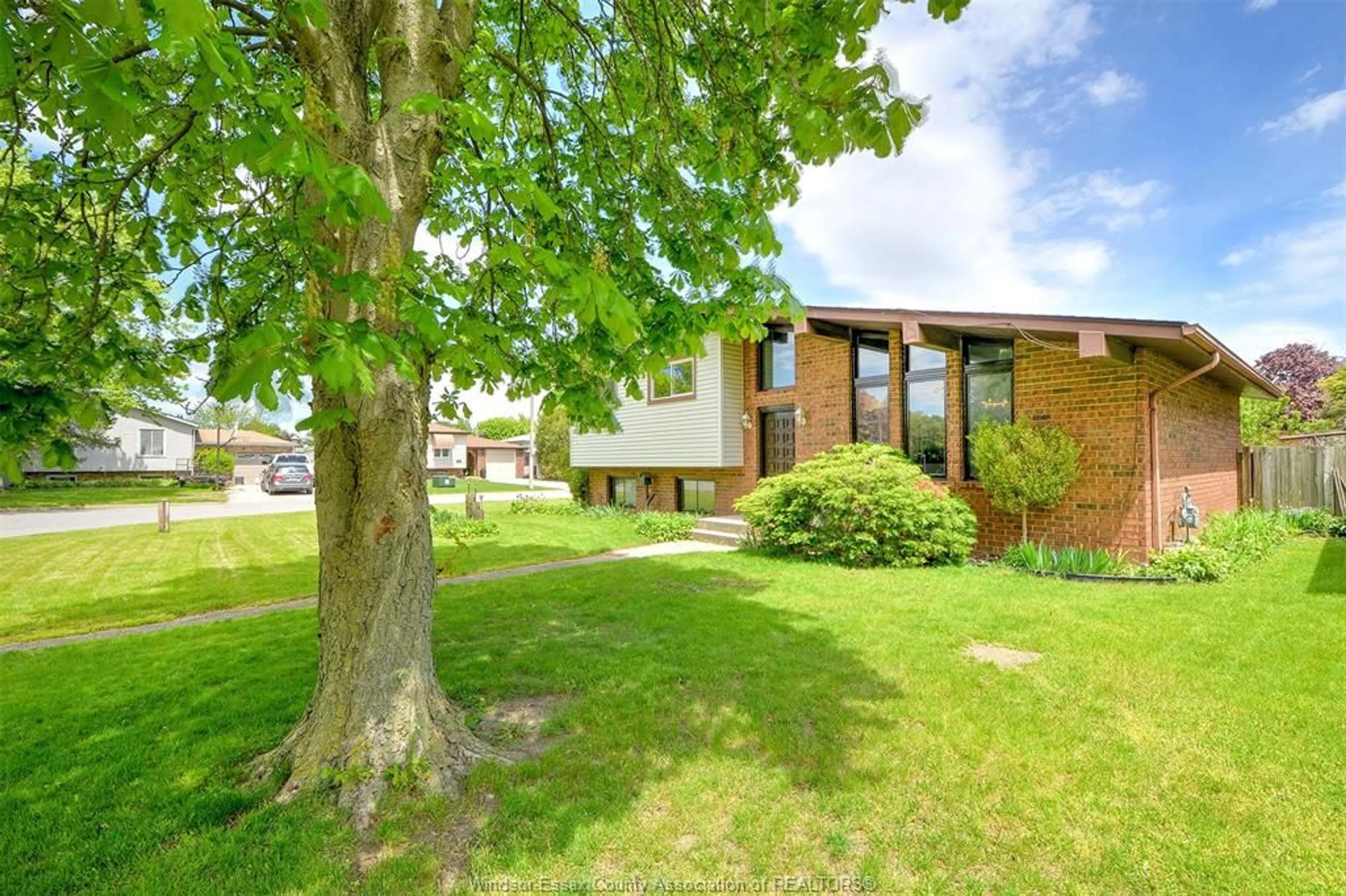Home with brick exterior material, street for 204 PEARSON Dr, Harrow Ontario N0R 1G0