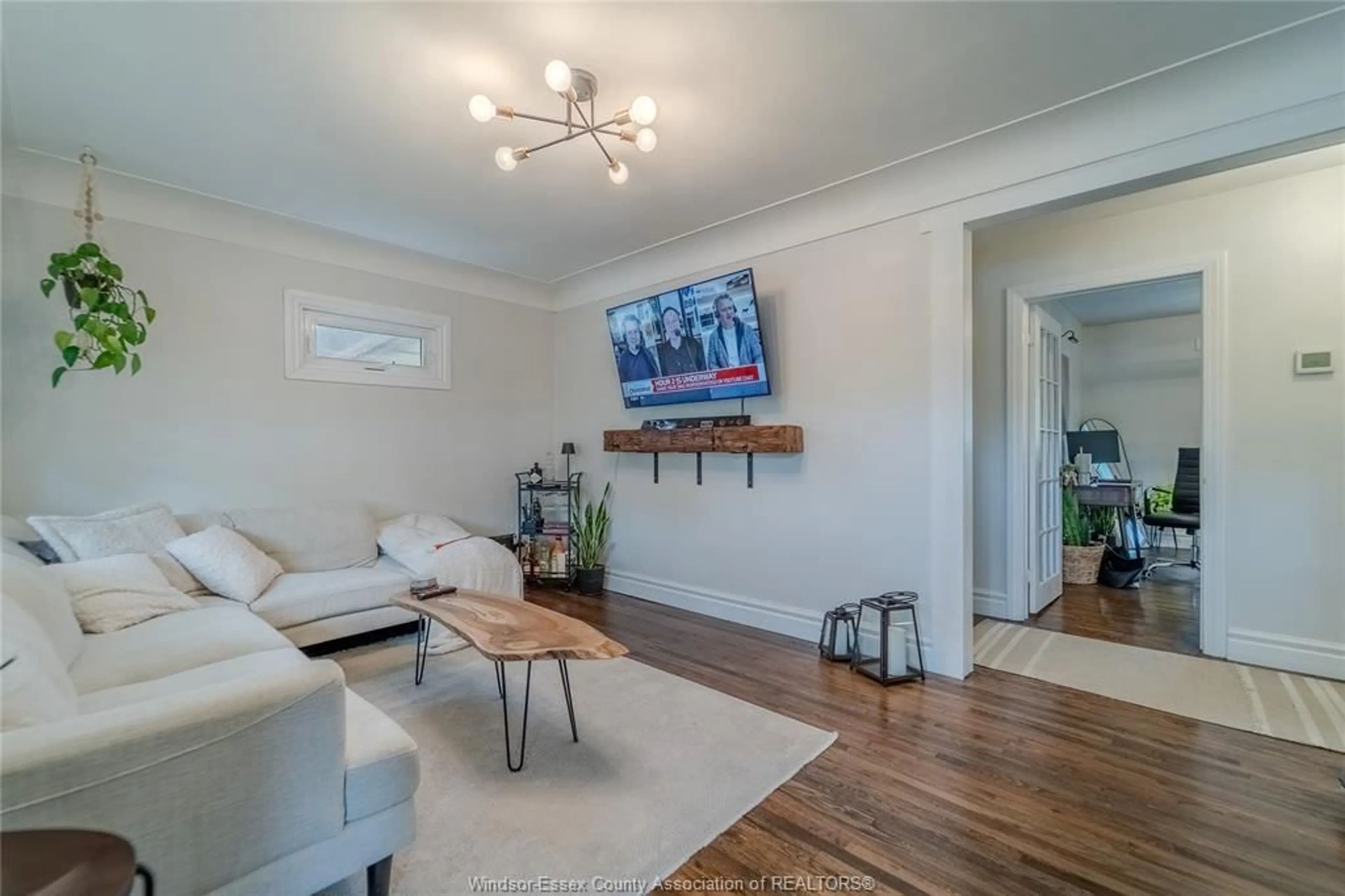 Living room with furniture, wood/laminate floor for 530 Lesperance Rd, Tecumseh Ontario N8N 1W4