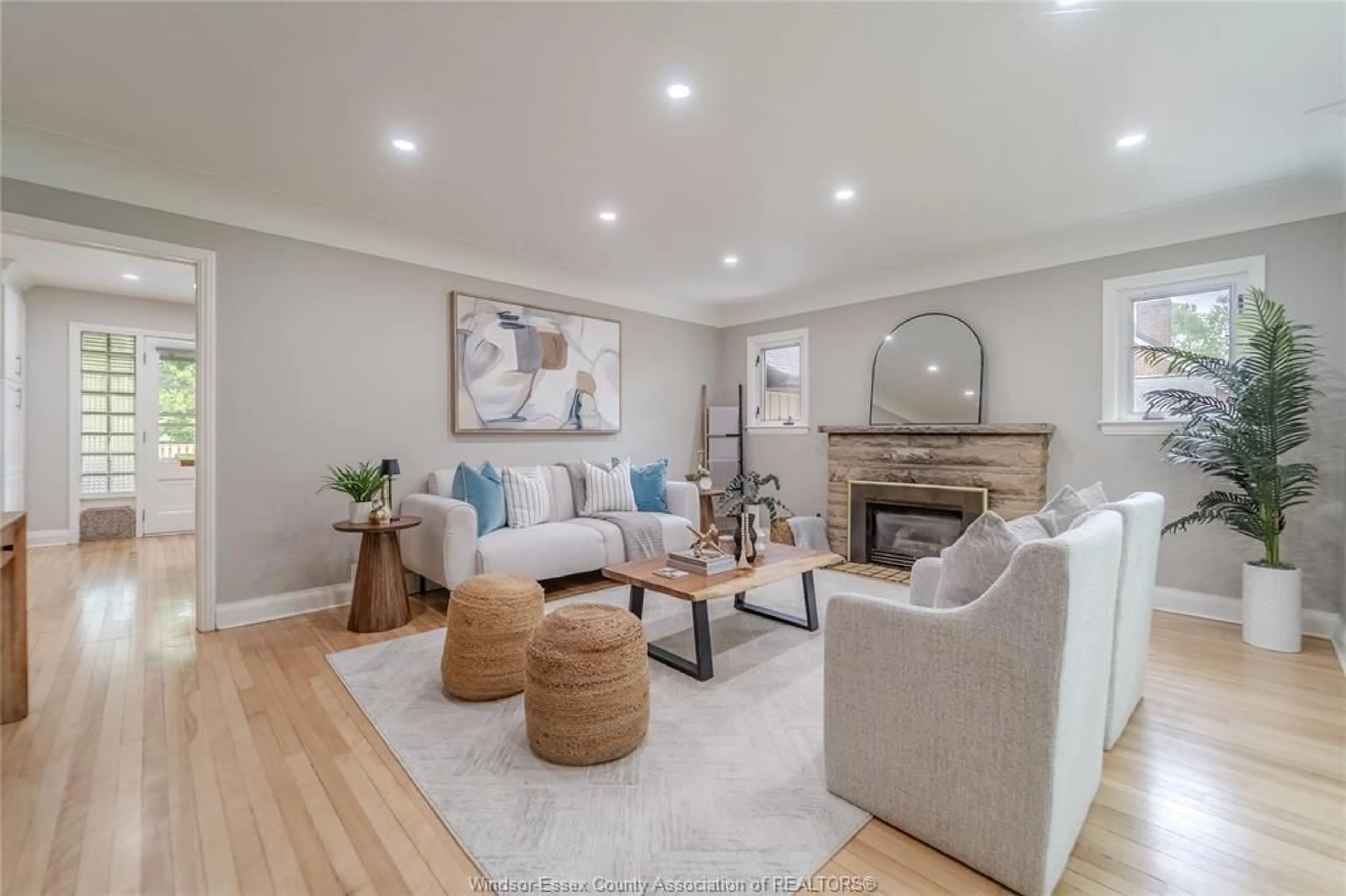 Living room with furniture, wood/laminate floor for 2458 Buckingham Dr, Windsor Ontario N8T 2B5