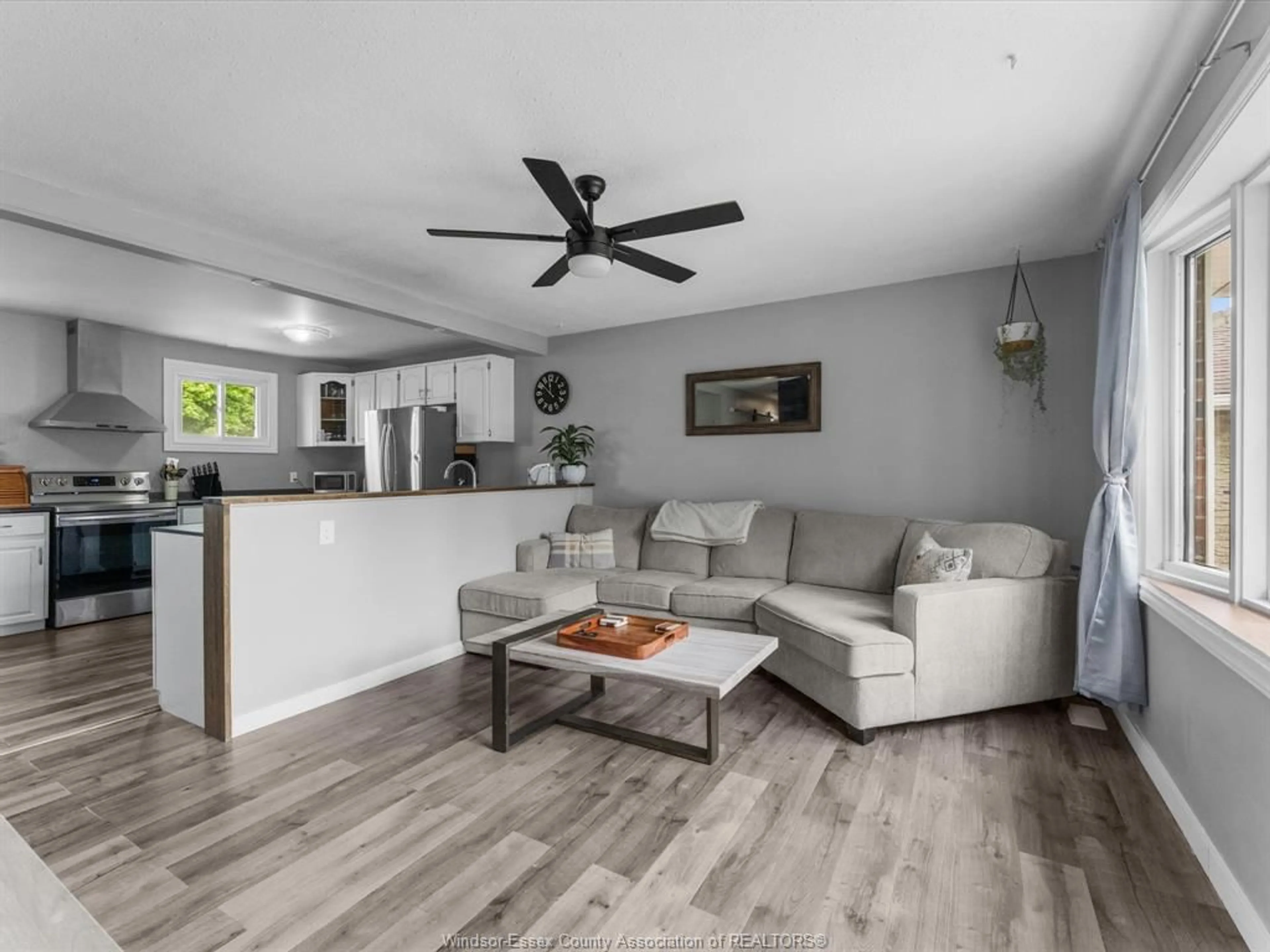Living room with furniture, wood/laminate floor for 28 St. Charles, Amherstburg Ontario N9V 3J7