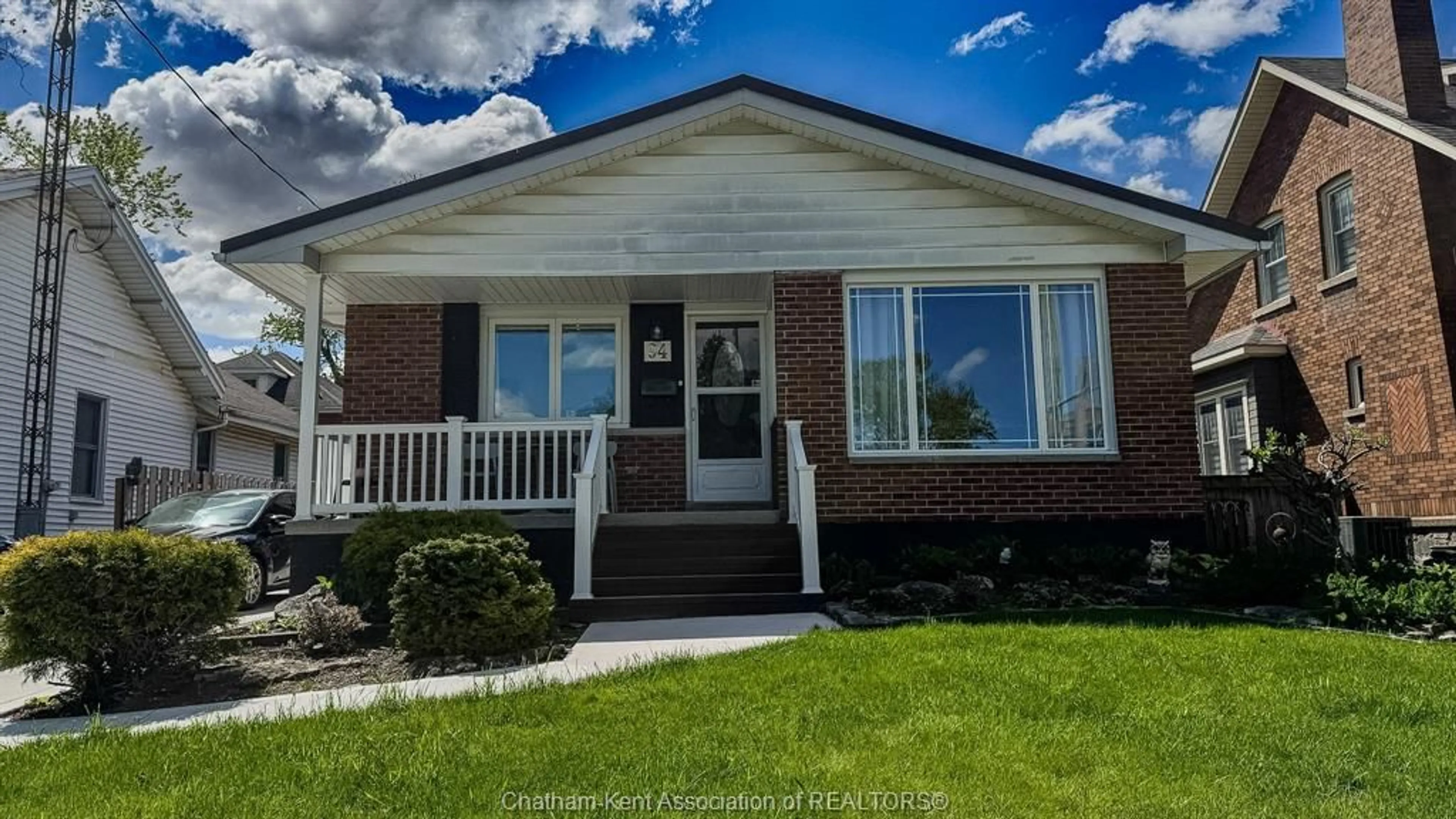Home with vinyl exterior material, street for 94 Stanley Blvd, Chatham Ontario N7M 3J3