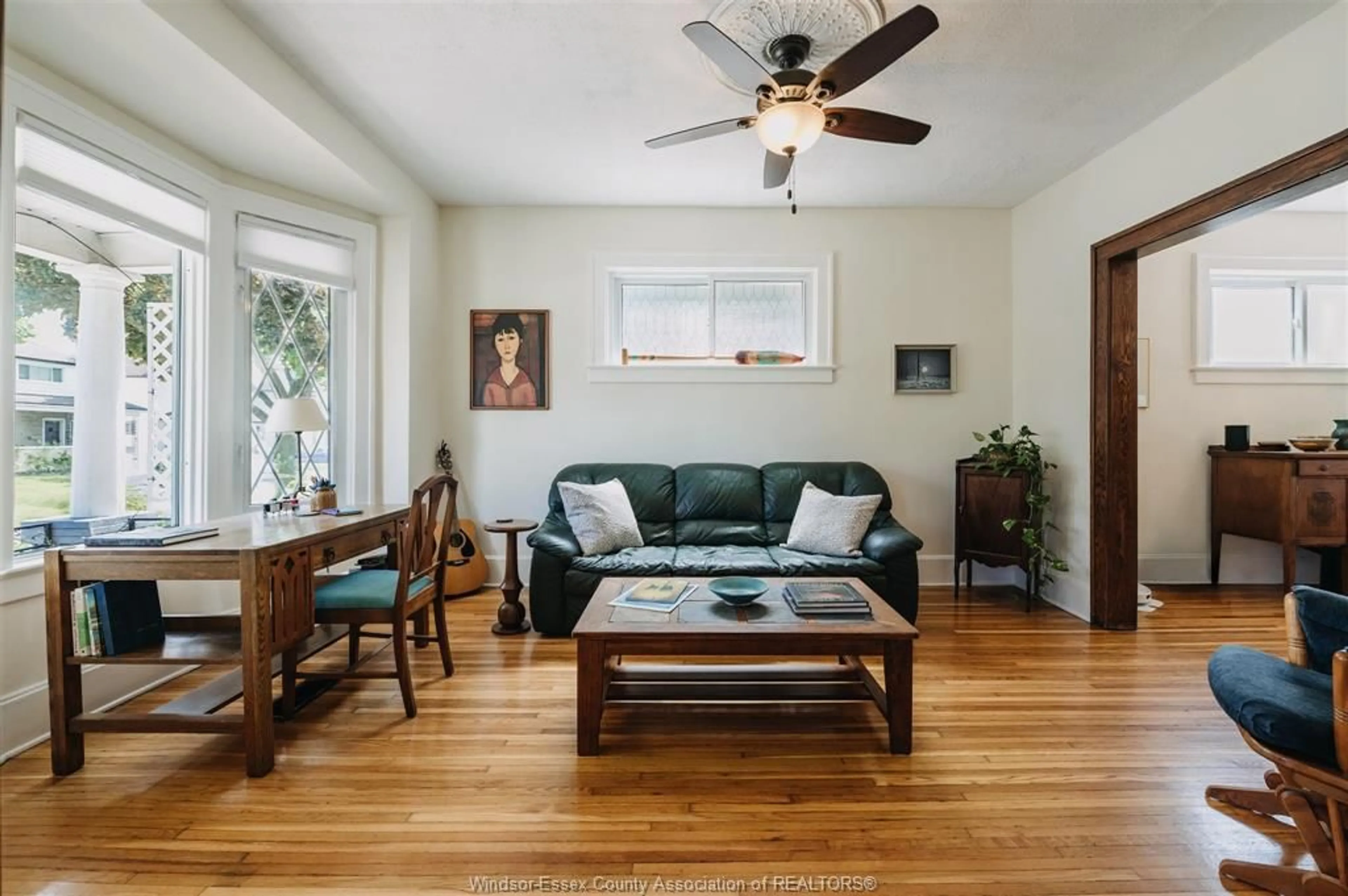 Living room with furniture, wood/laminate floor for 235 Oak Ave, Windsor Ontario N9A 5E5
