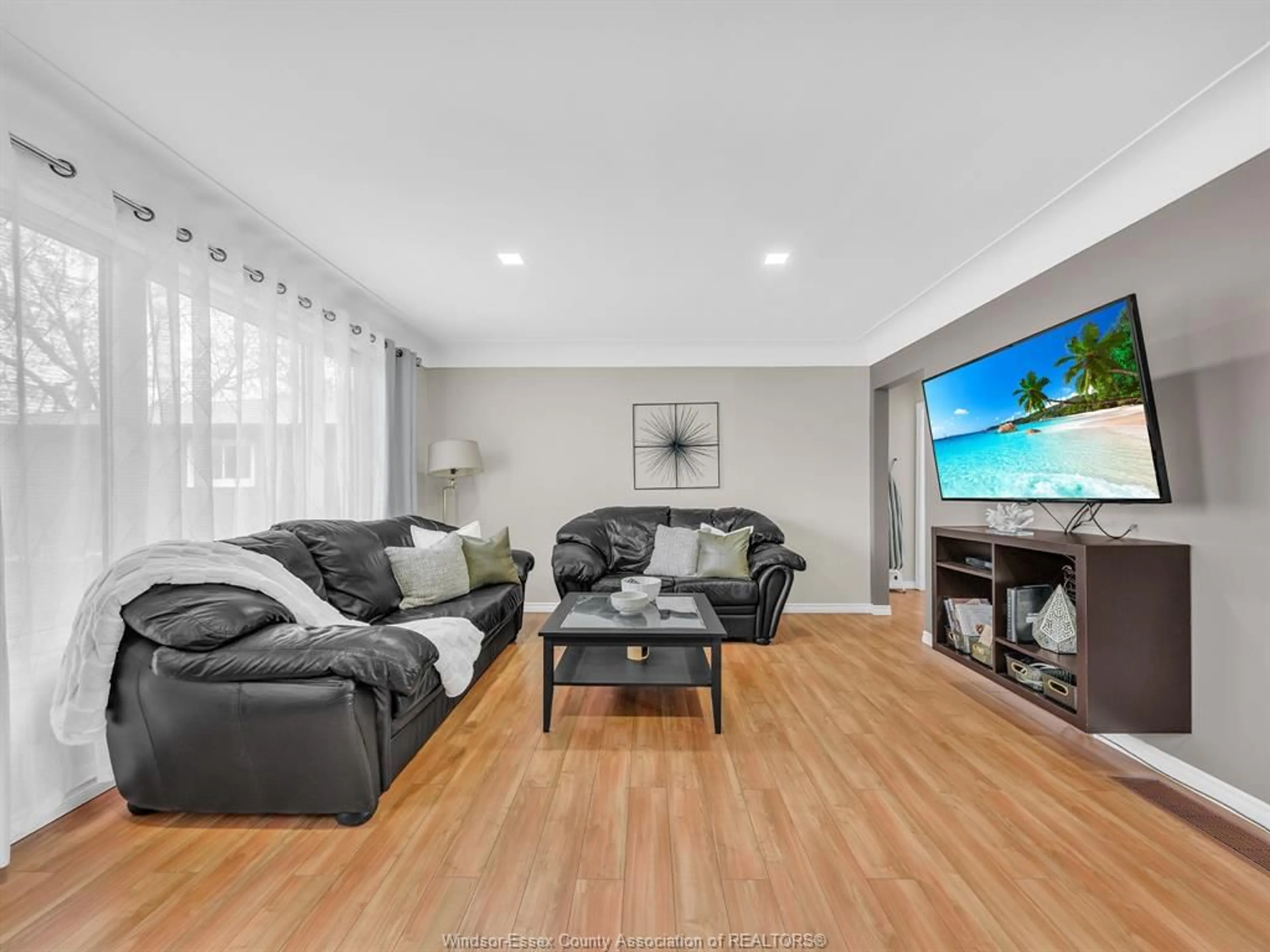 Living room with furniture, wood/laminate floor for 162 Robson Rd, Leamington Ontario N8H 5R1